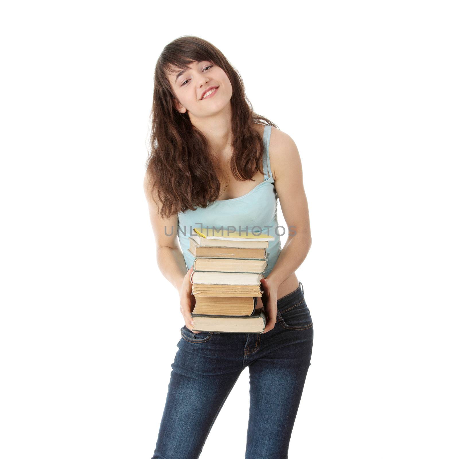 Teen student girl with lot of heavy books isolated on white background