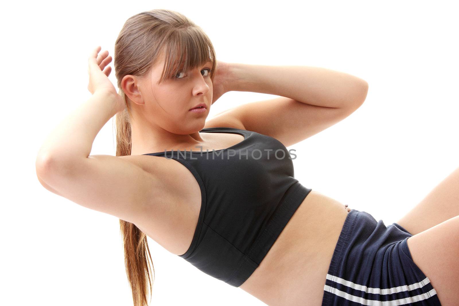 Relaxed fit woman doing exercise, isolated on white background.