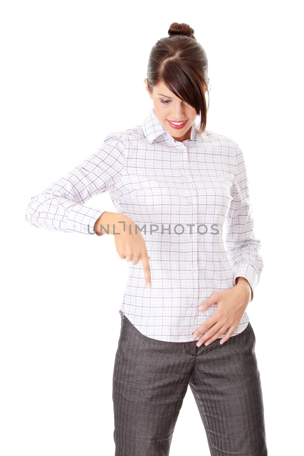 Young happy businesswoman pointing direction, isolated on white