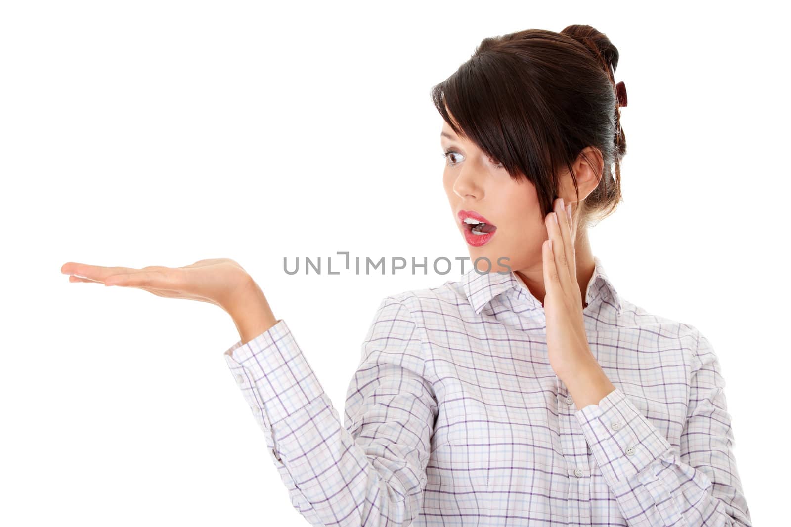 Young happy businesswoman presenting something on her hand, isolated on white