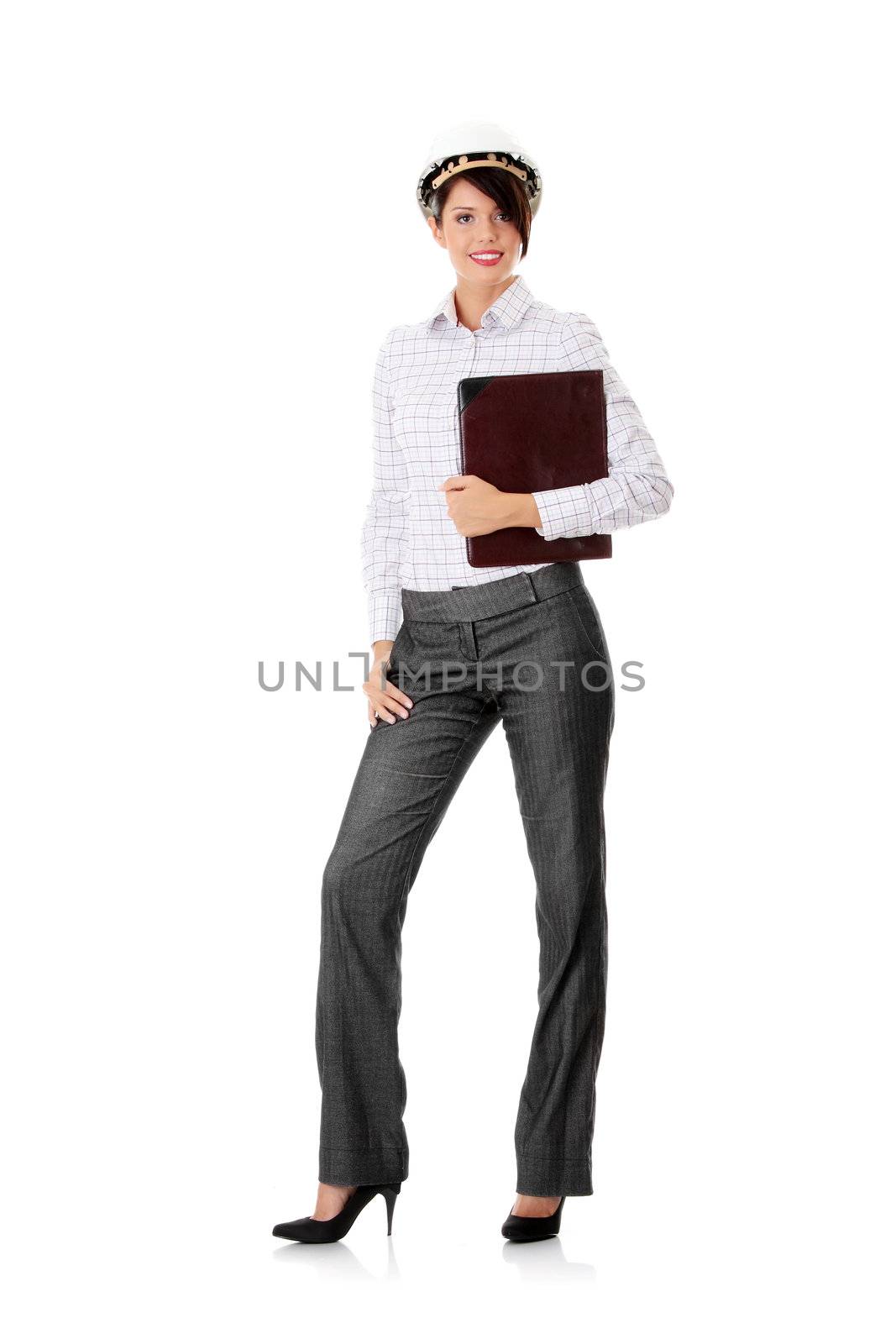 Portrait of confident female worker in helmet