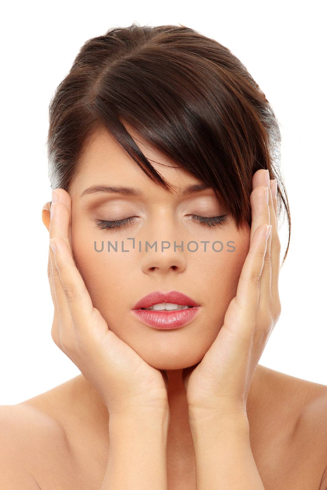 Beautiful woman's face with fresh clean skin isolated on white