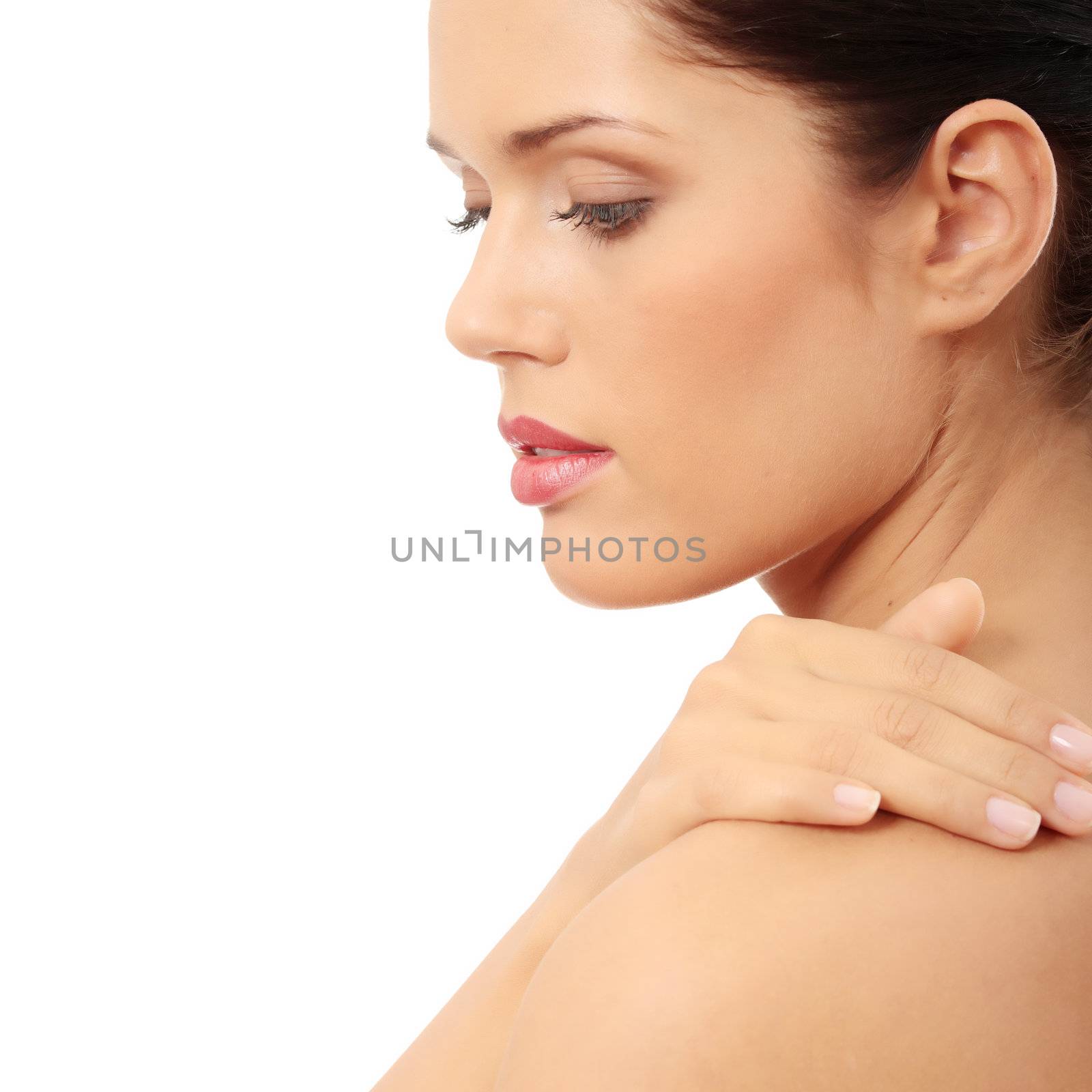 Beautiful woman's face with fresh clean skin isolated on white