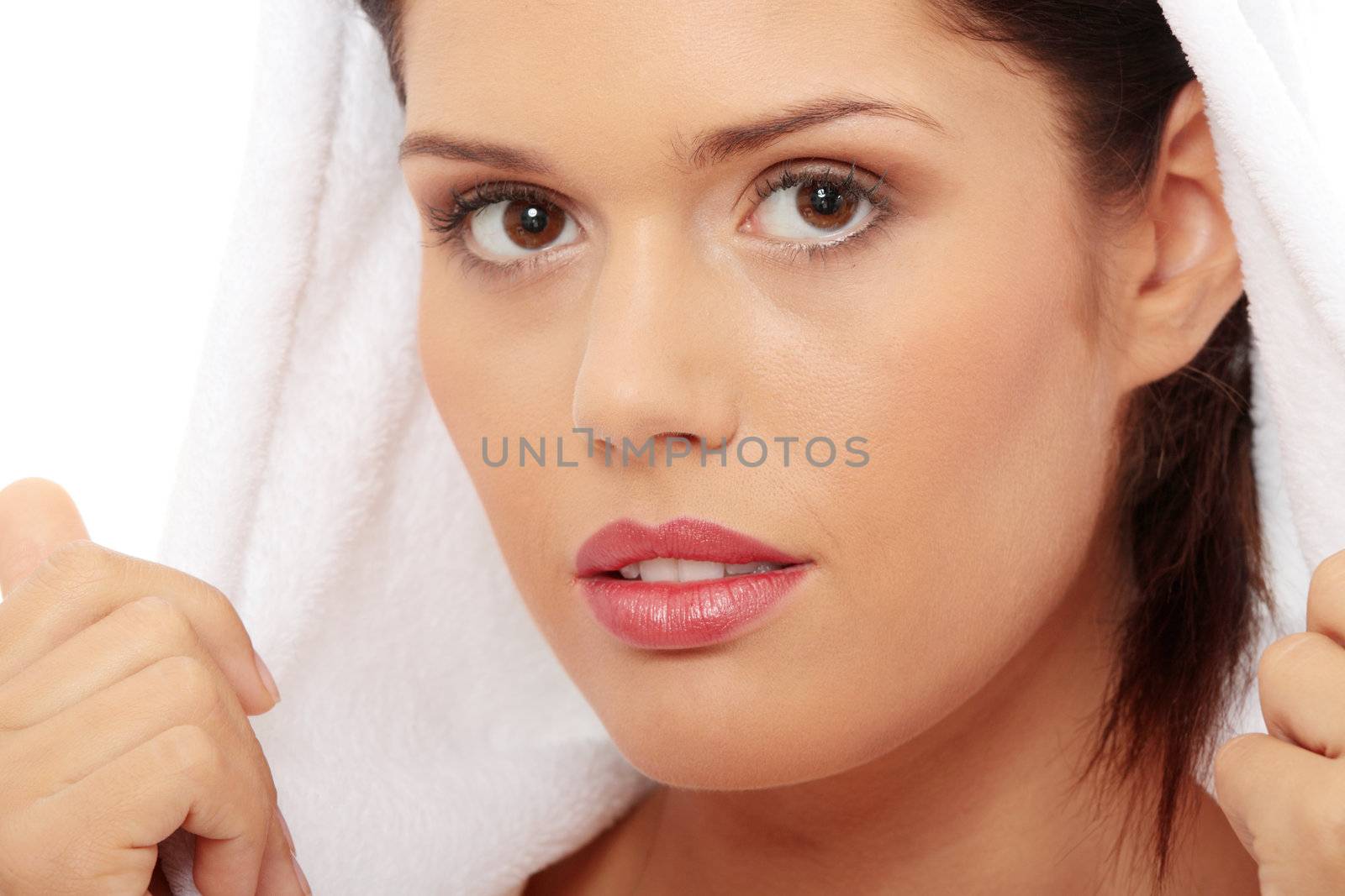 Young beautiful caucasian woman after bath isolated on white