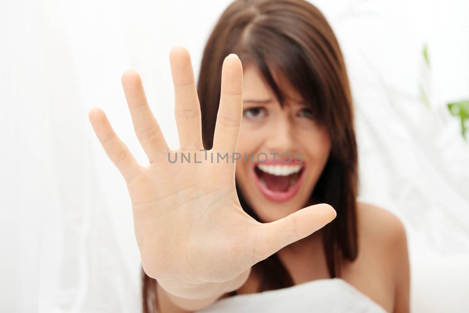 Young beautiful caucasian woman in bed abused