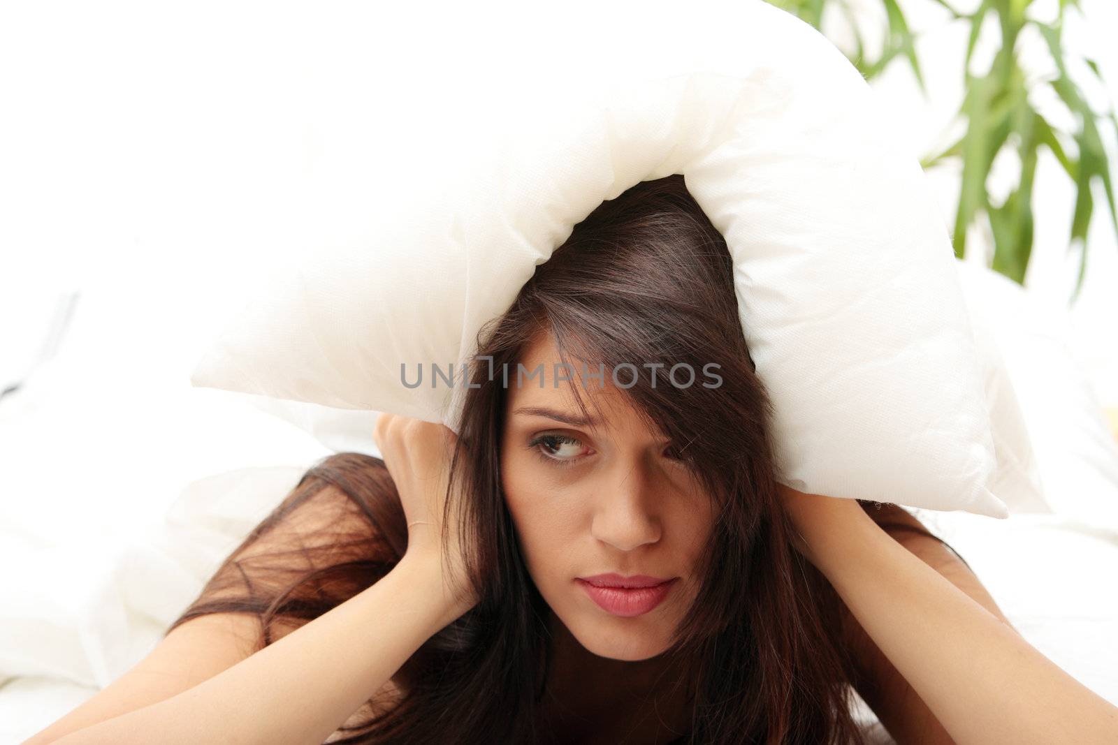 Young caucasian female on bed