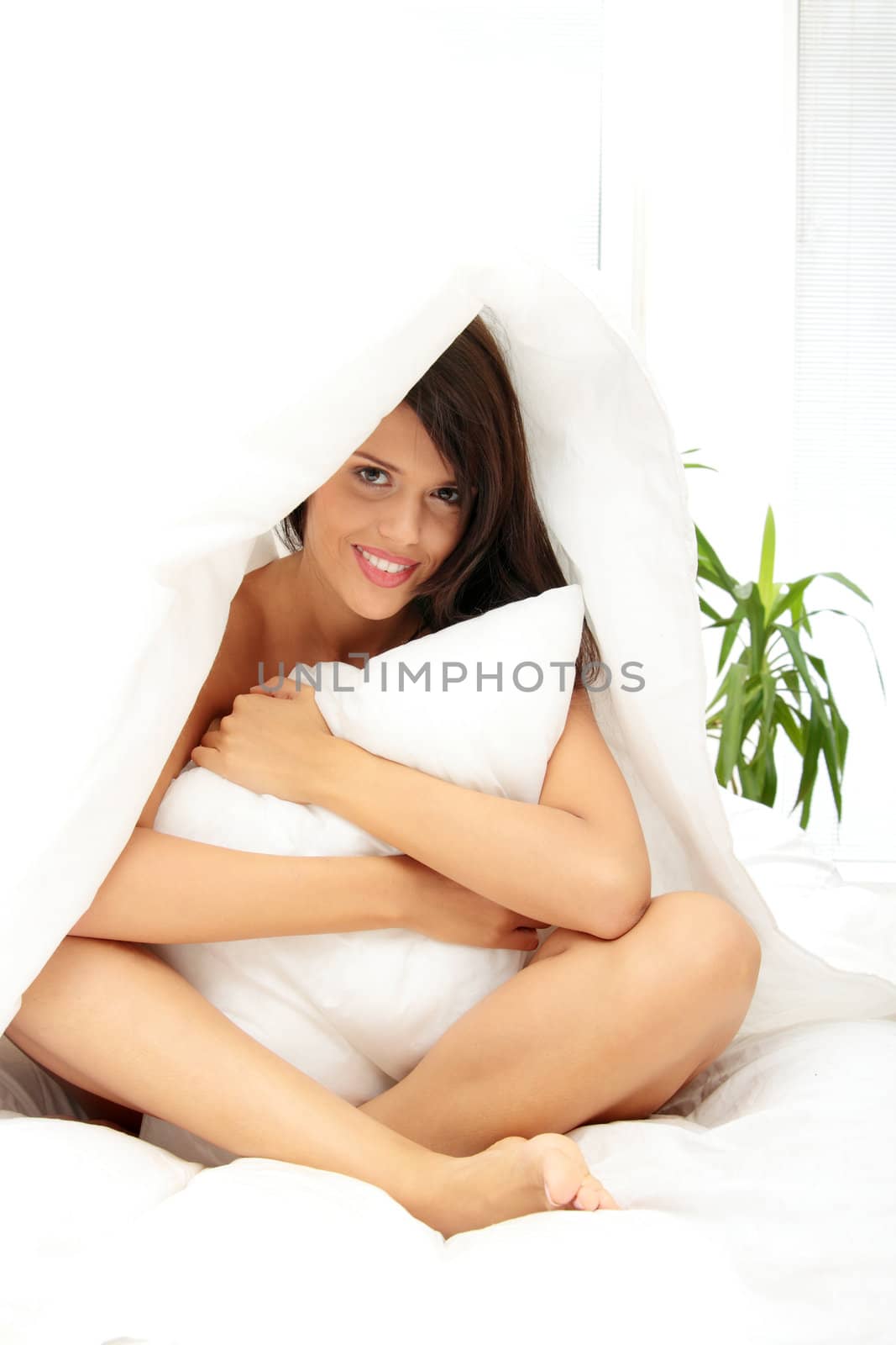 Young woman in her bedroom at home