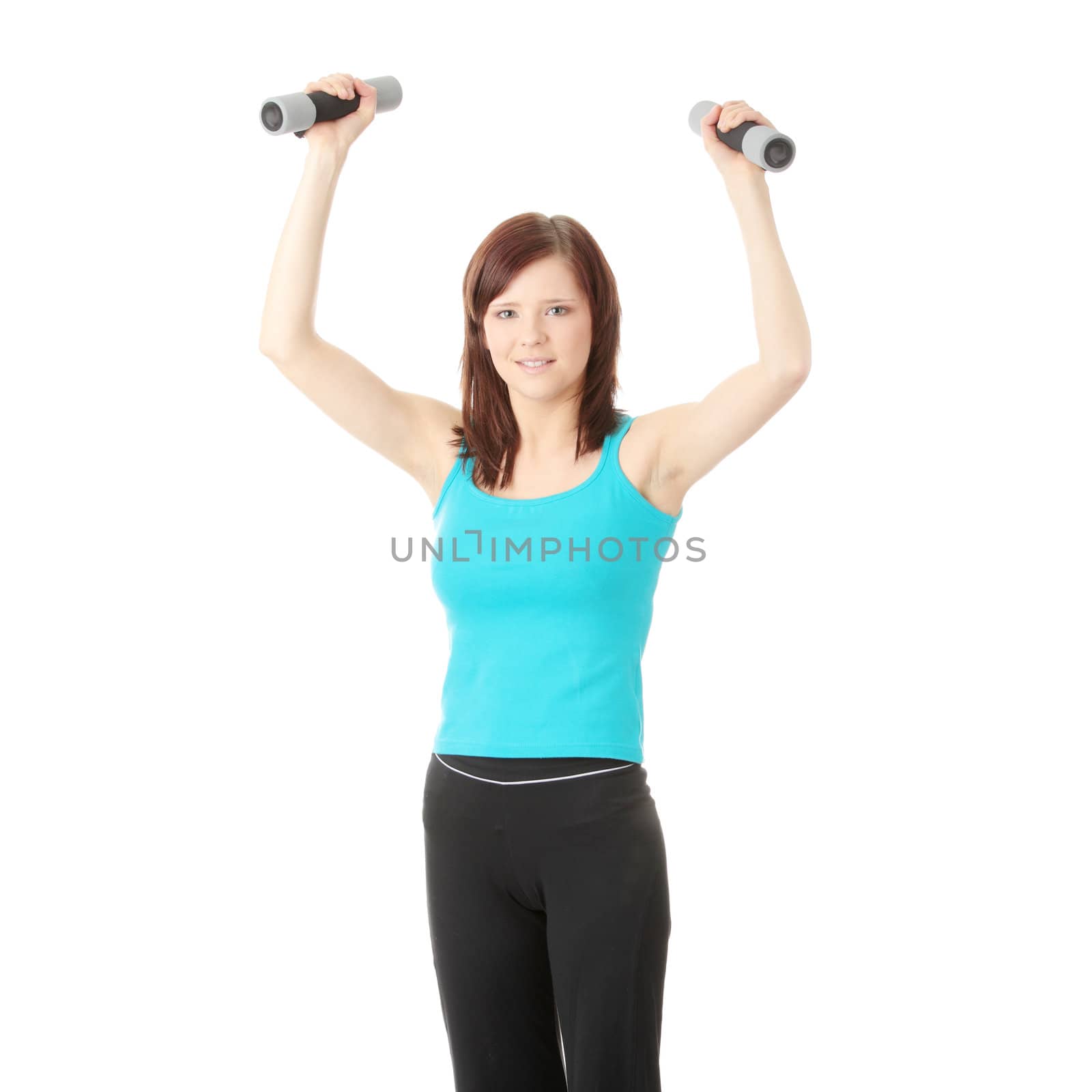Portrait of beautiful smiling girl with dumbbells.