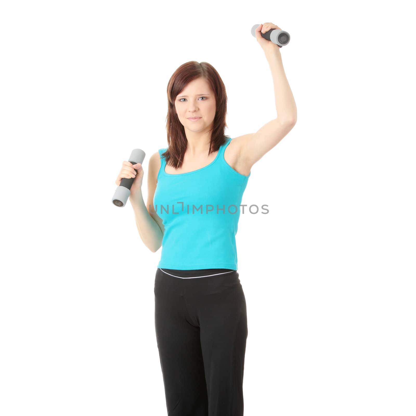 Portrait of beautiful smiling girl with dumbbells.