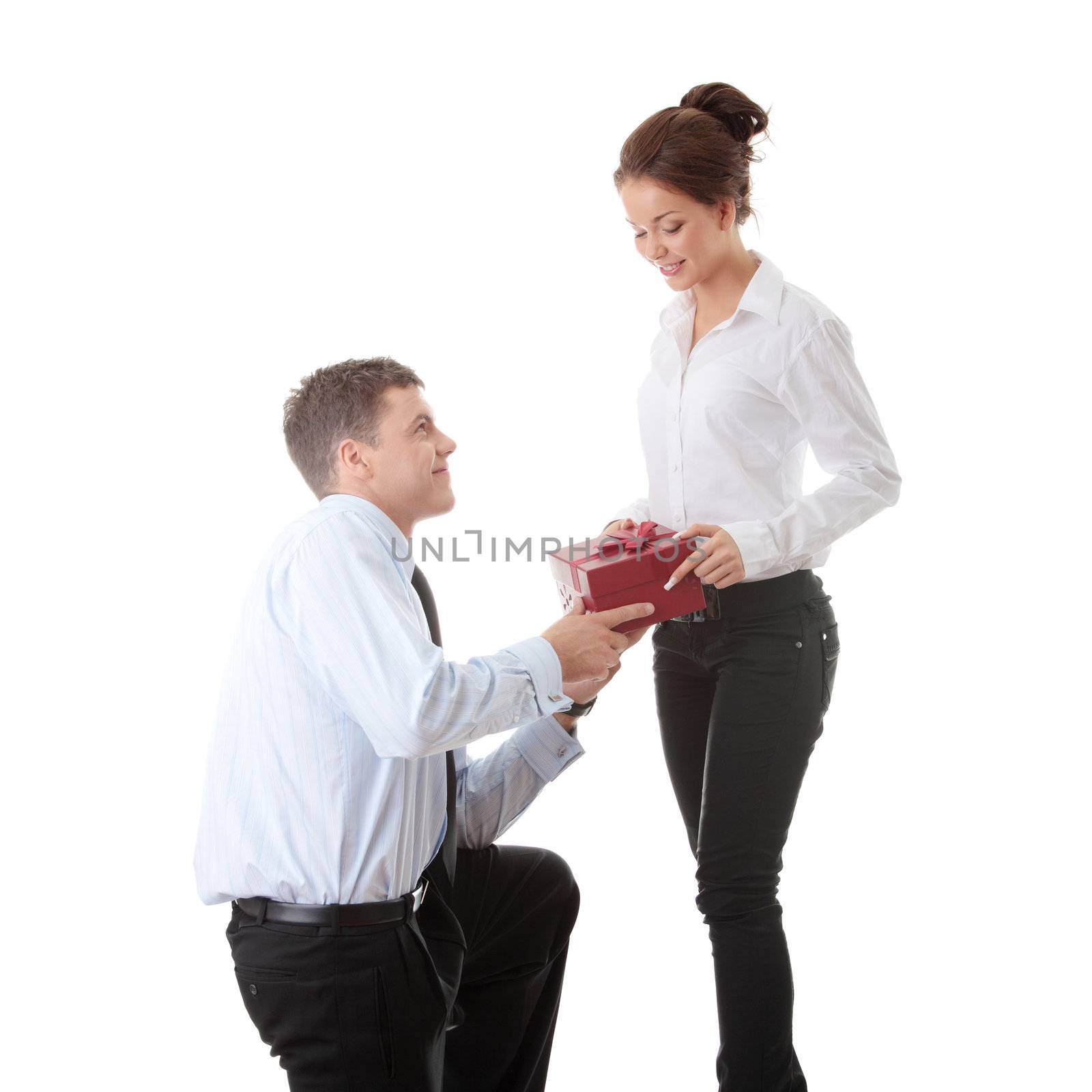 Business man offering a gift to a woman, isolated on white