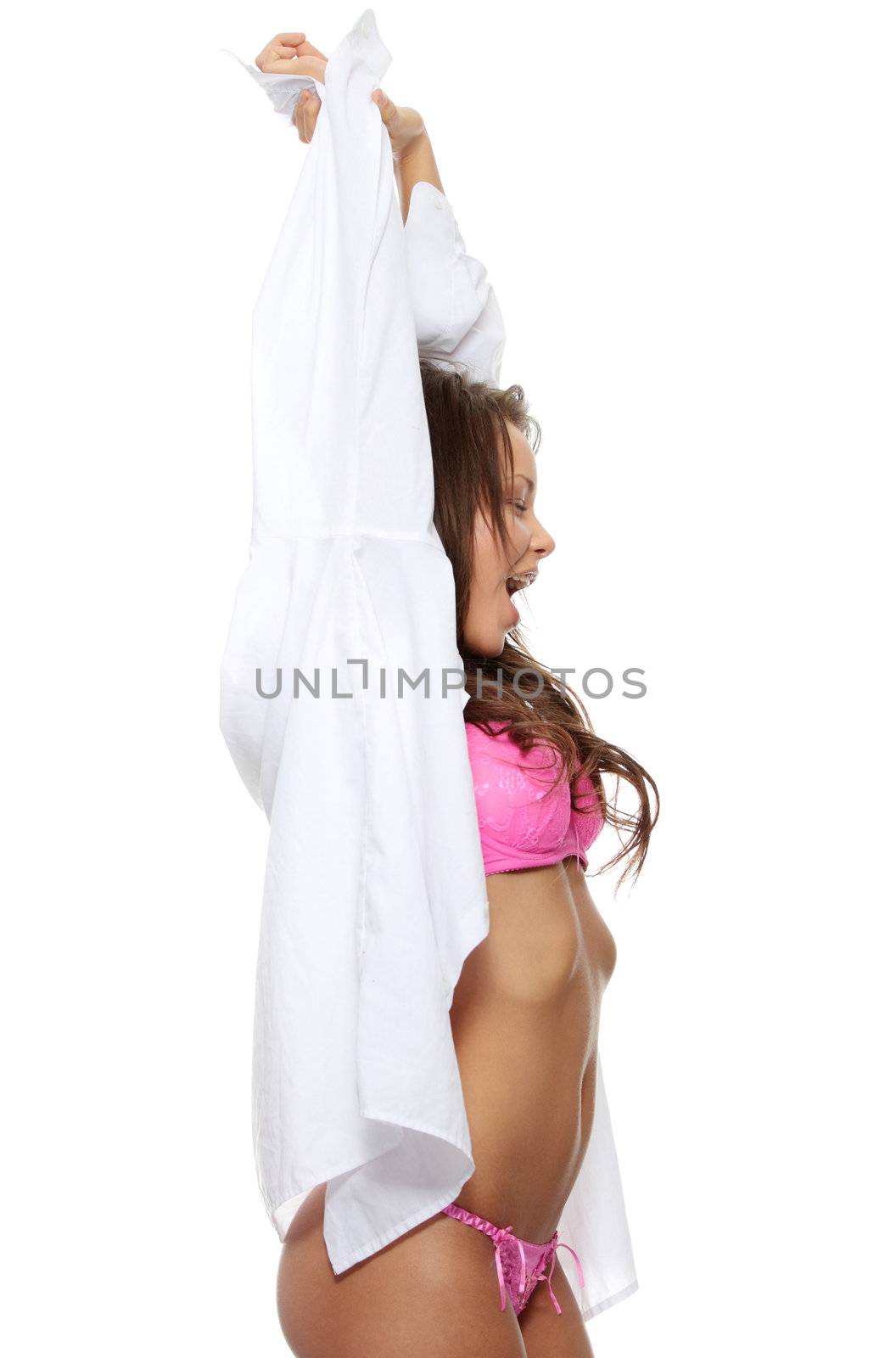 Young morning girl in big shirt and underwear