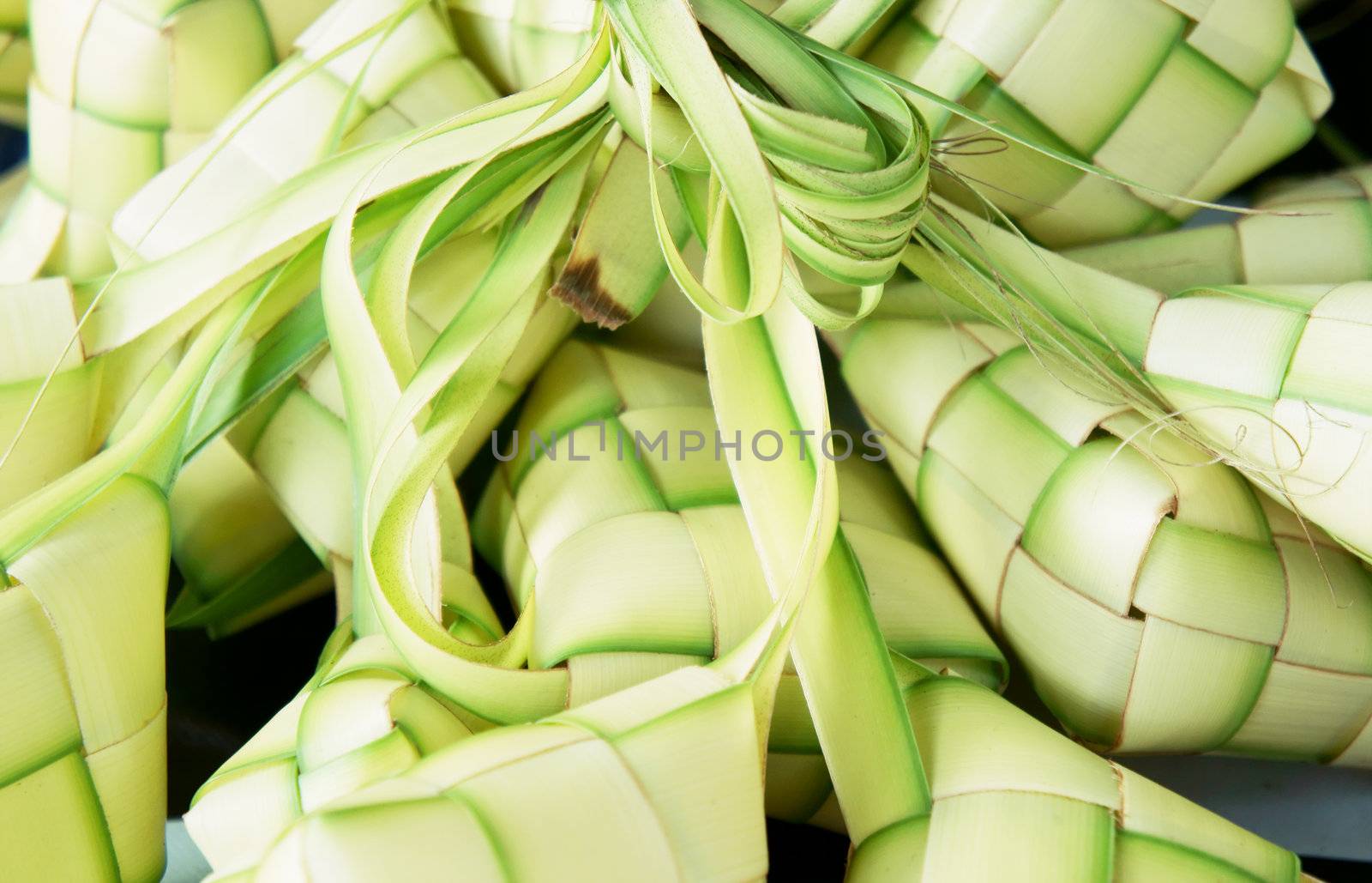 Ketupat: South East Asian rice cakes bundle, often prepared for festivities and celebratory occasions.                   
