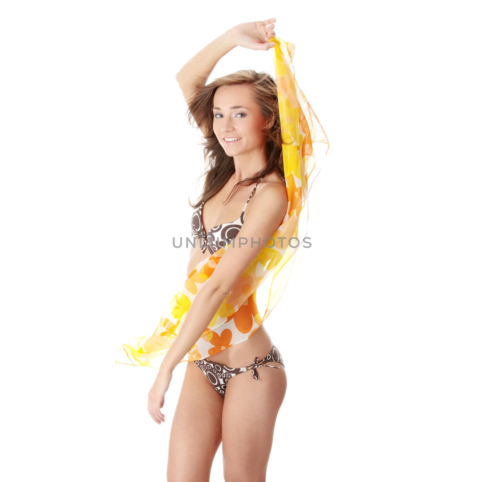 Young beautiful slim woman posing in bikini - with wind