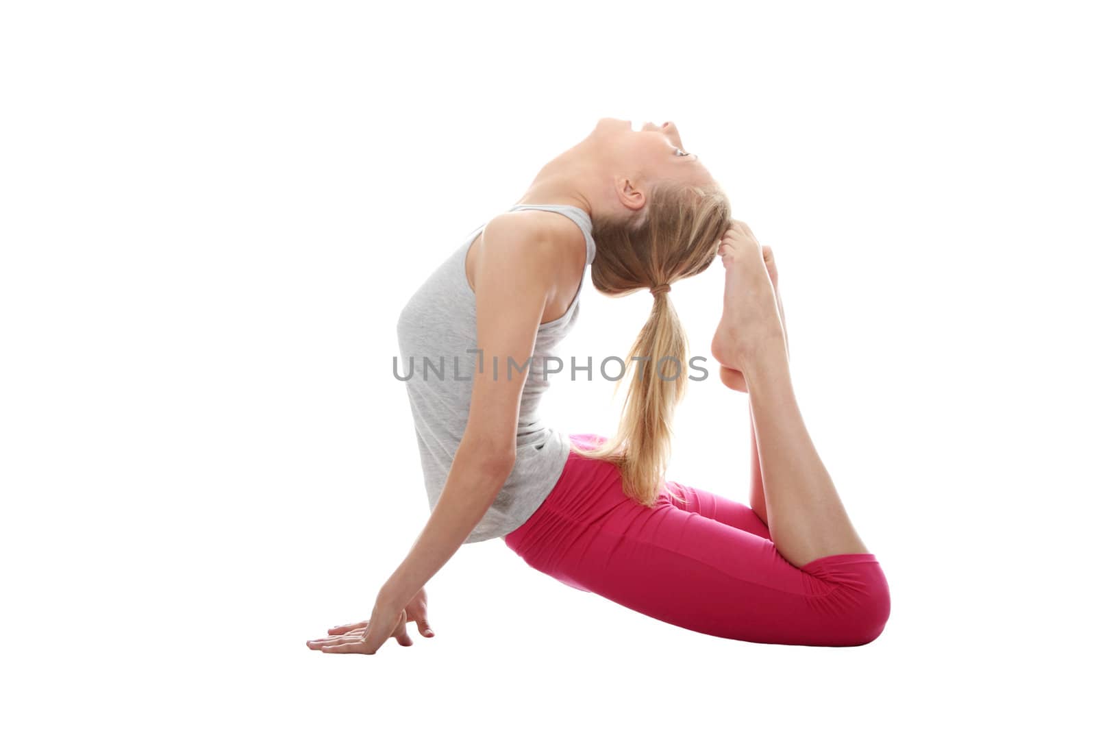 Young woman makes exercise isolated on white