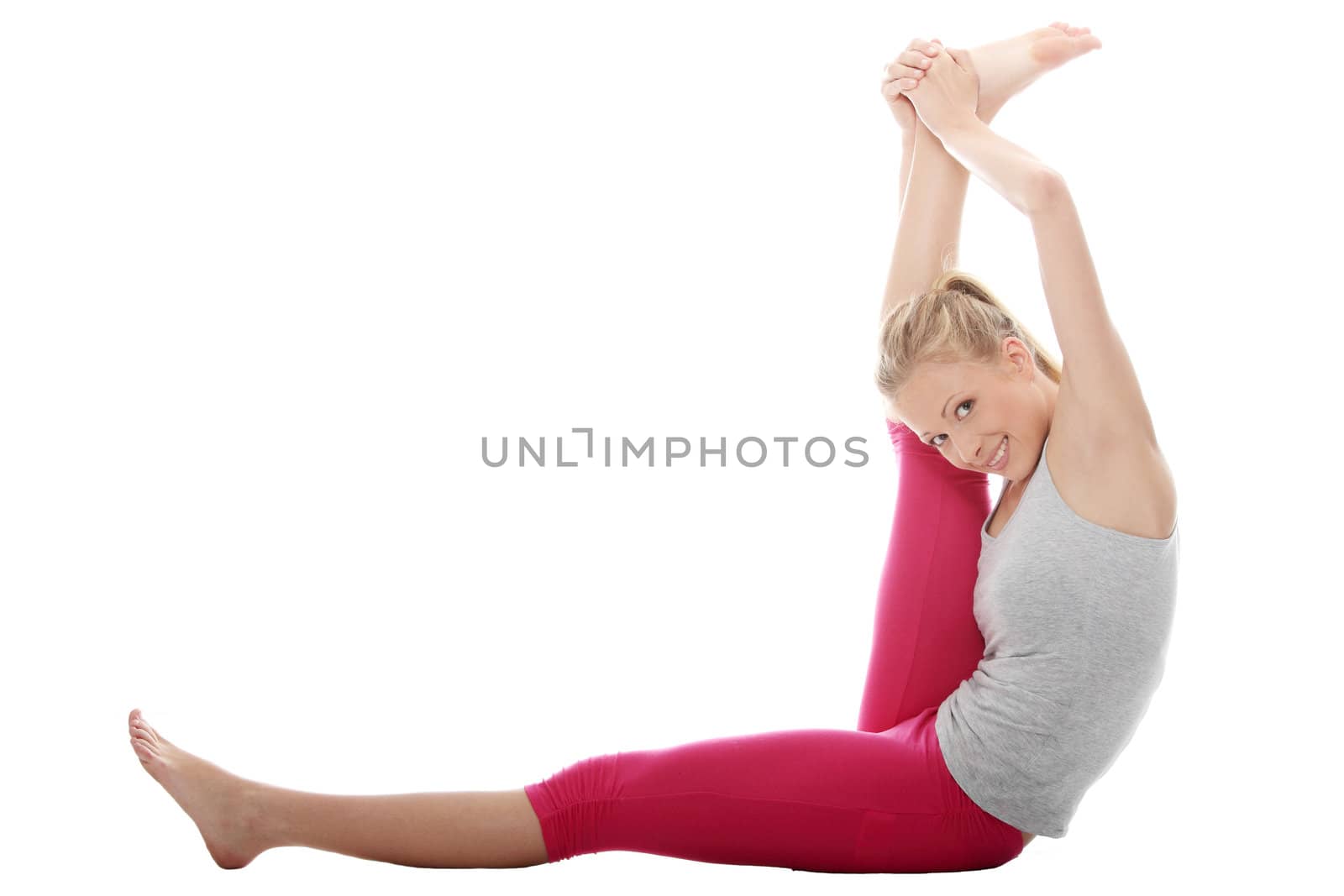 Young woman makes exercise isolated on white