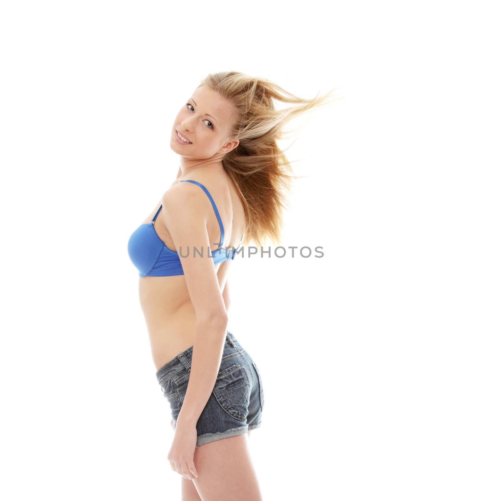 Happy beautiful sexy young woman in shorts, isolated on white