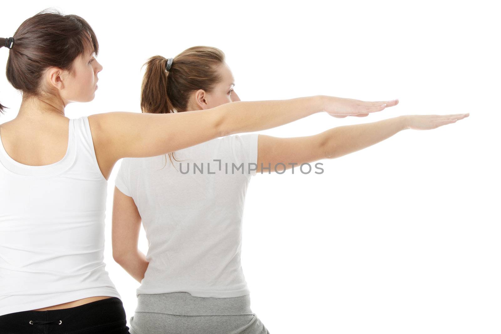 Two womans exercising, isolated on white background