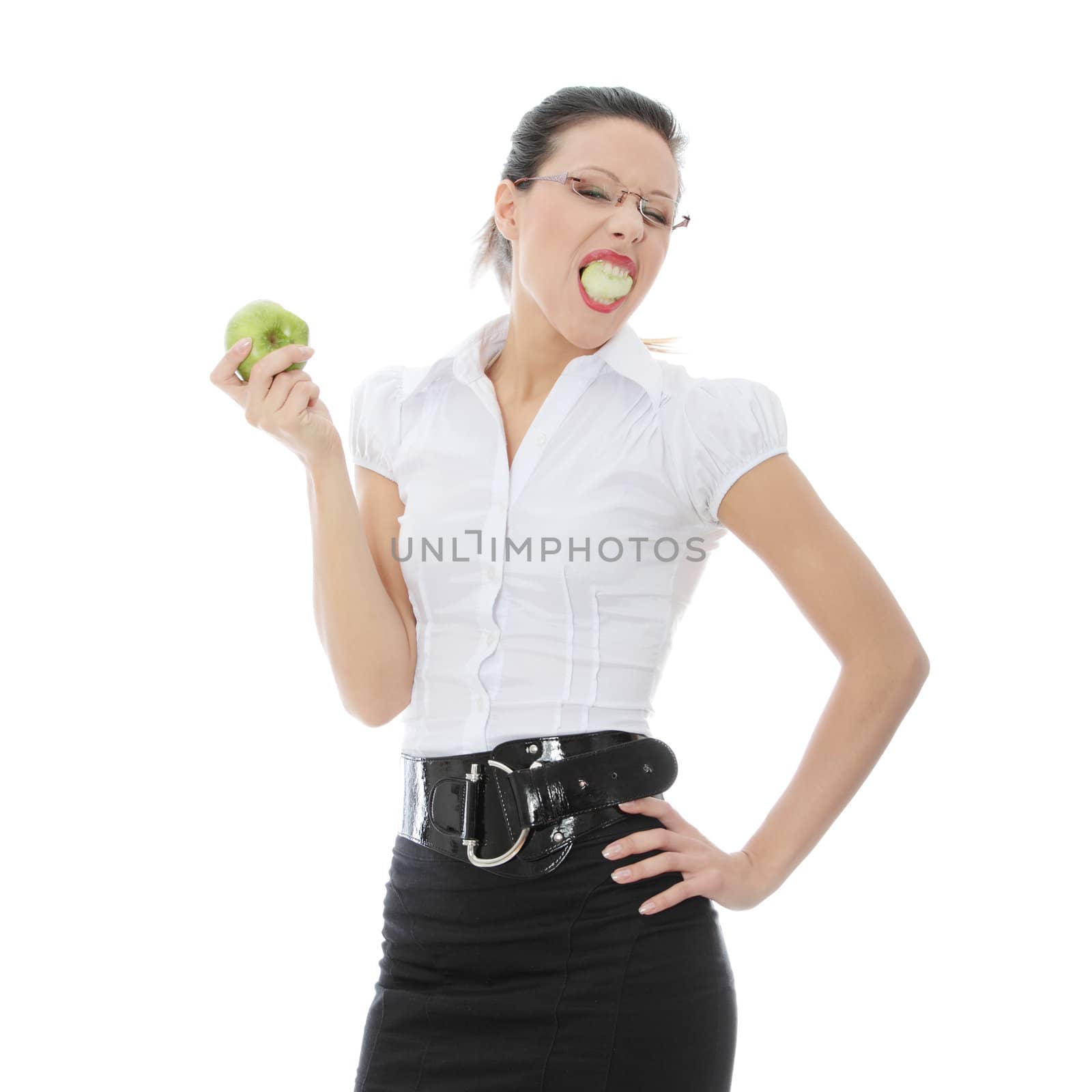 Young businesswoman with green apple in her hand - healthy eating concept