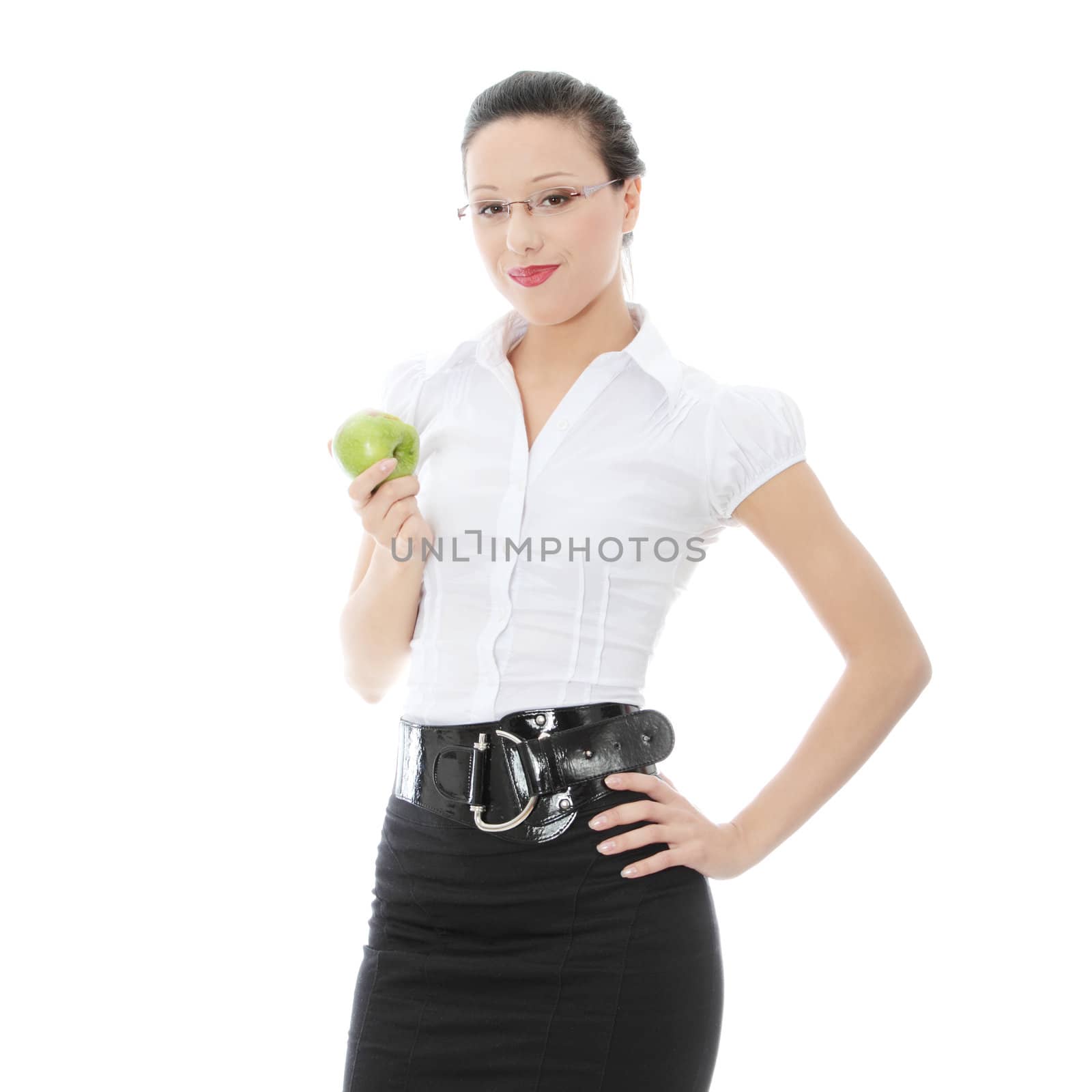 Young businesswoman with green apple in her hand - healthy eating concept