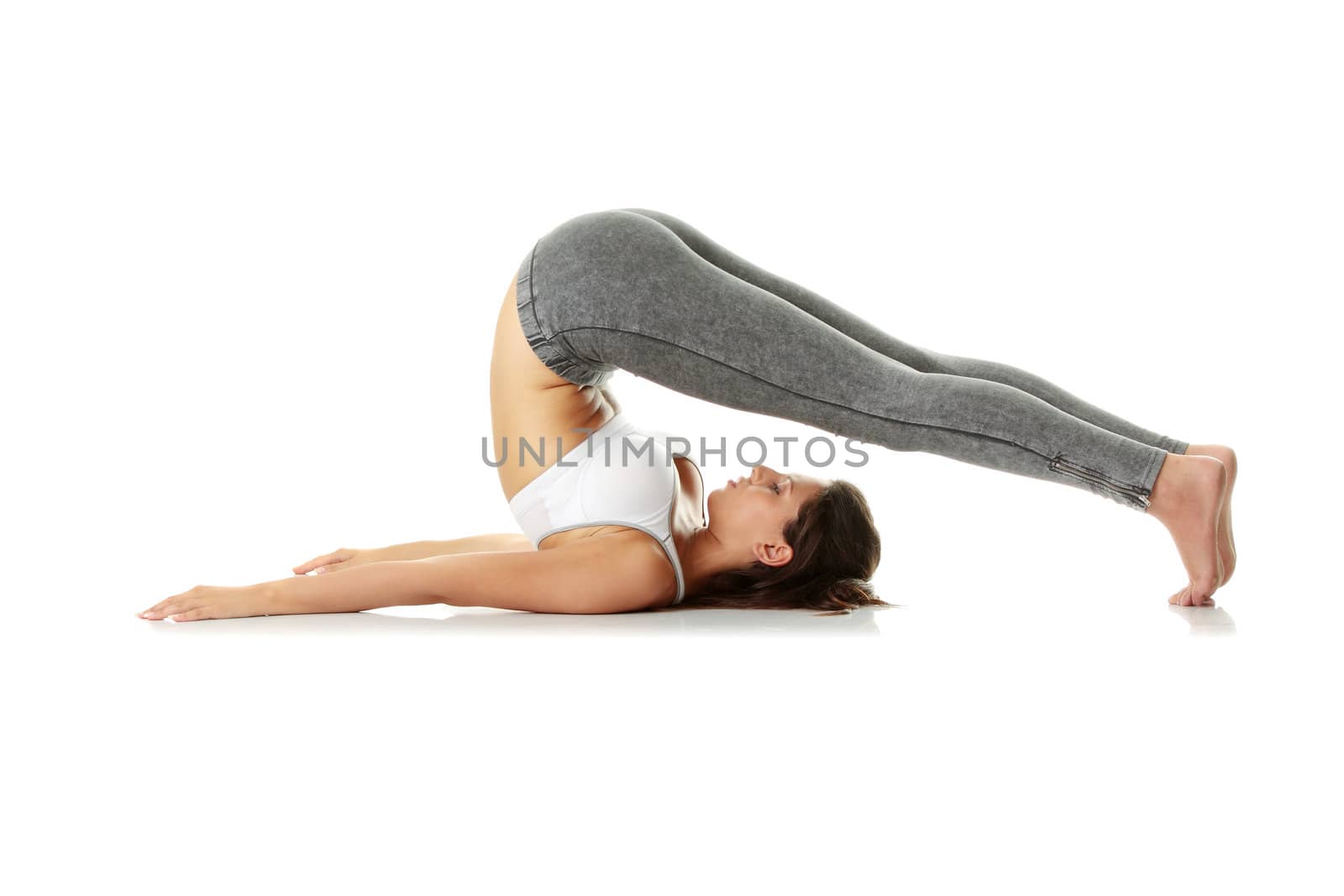 Young woman doing exercise, isolated on white