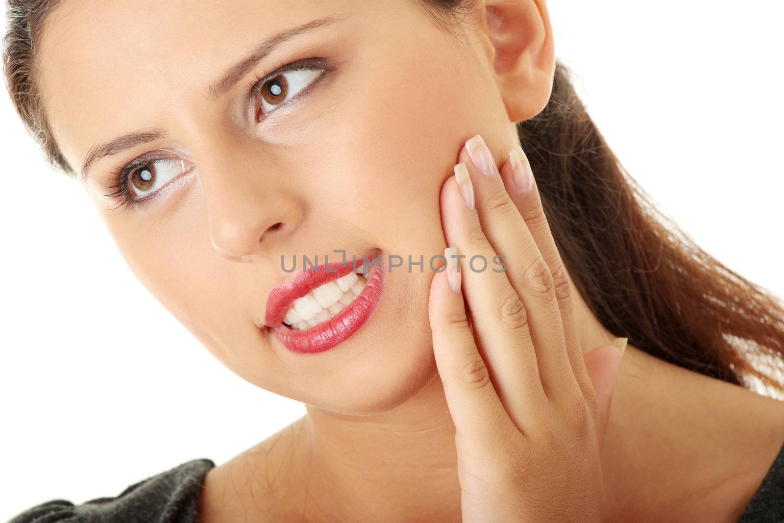 Young woman in pain is having toothache isolated on white