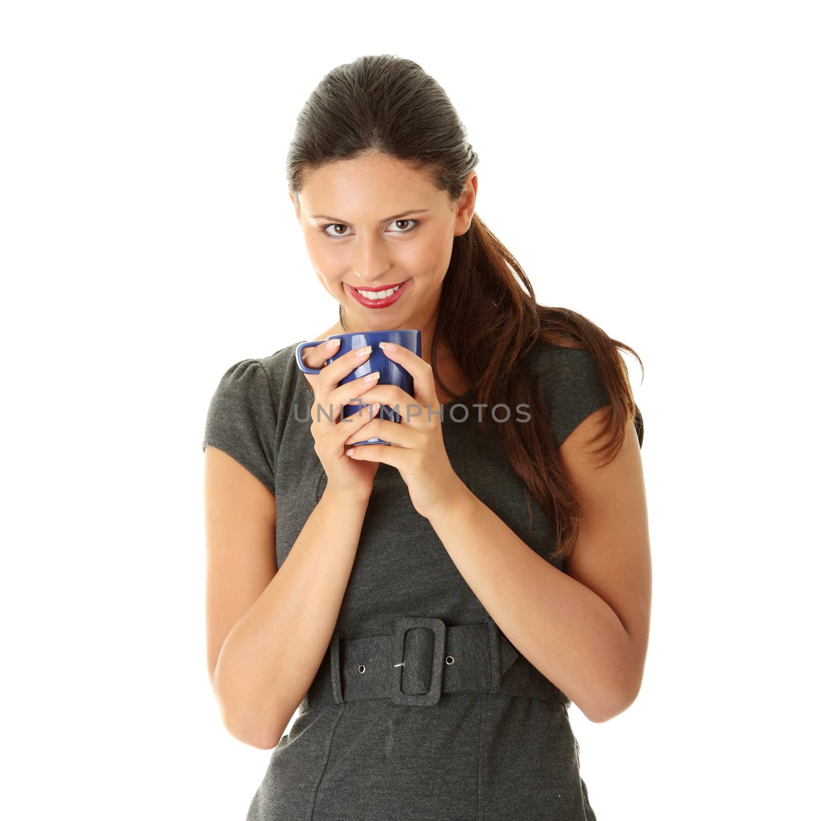 Portrait of cheerful businesswoman holding coffee cup against white background