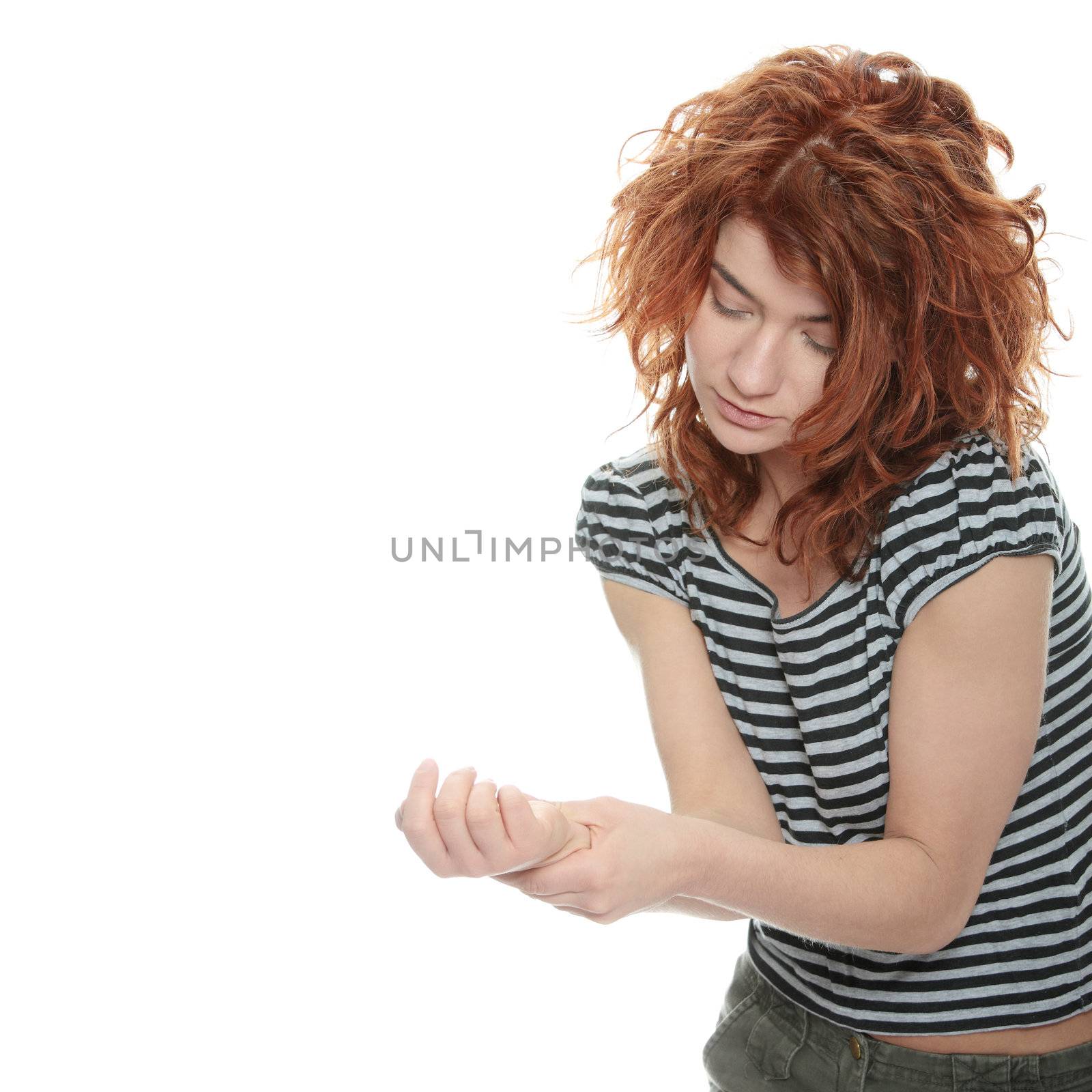 Woman holding her wrist - pain concept