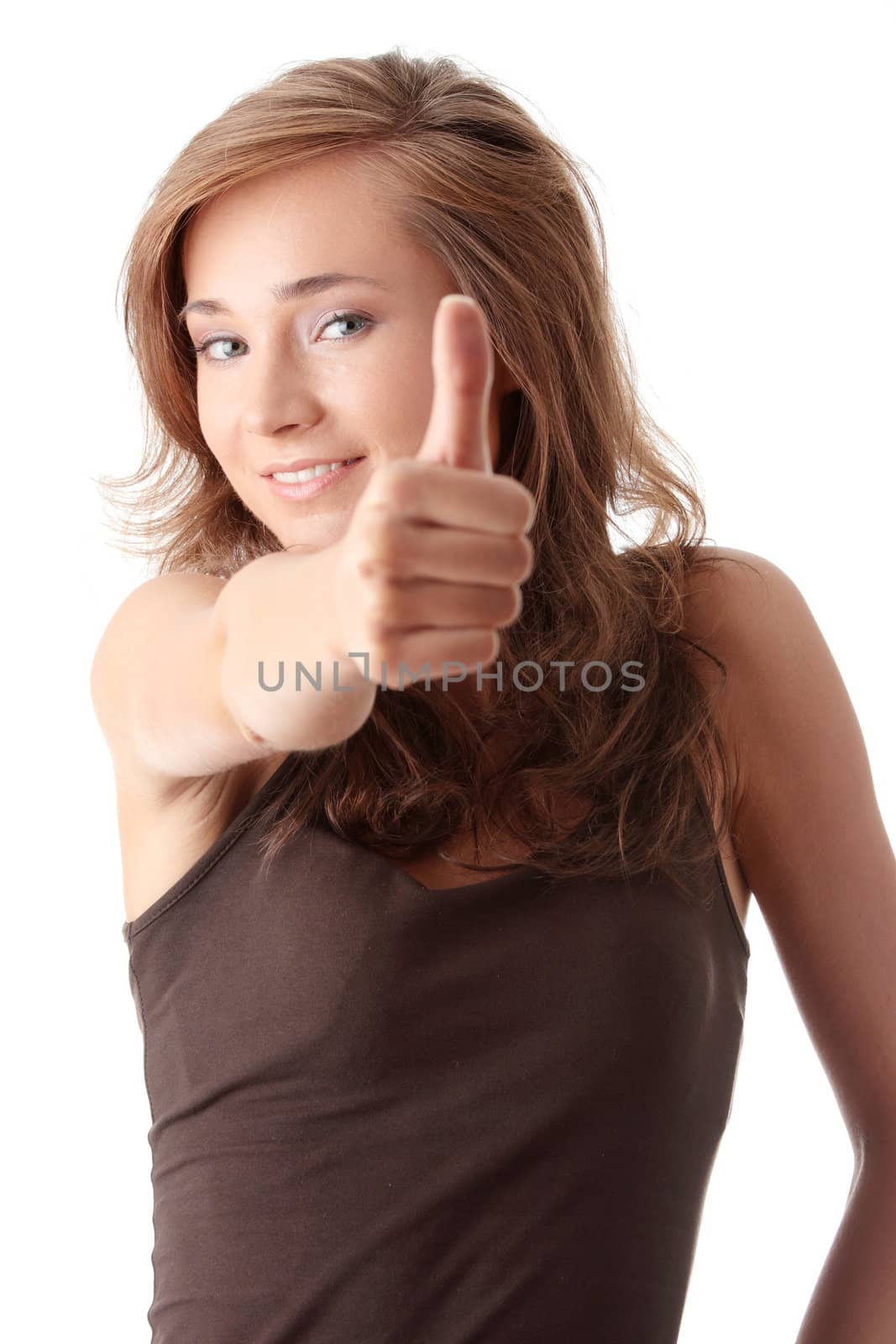 Closeup portrait of a beautiful young woman showing thumbs up sign