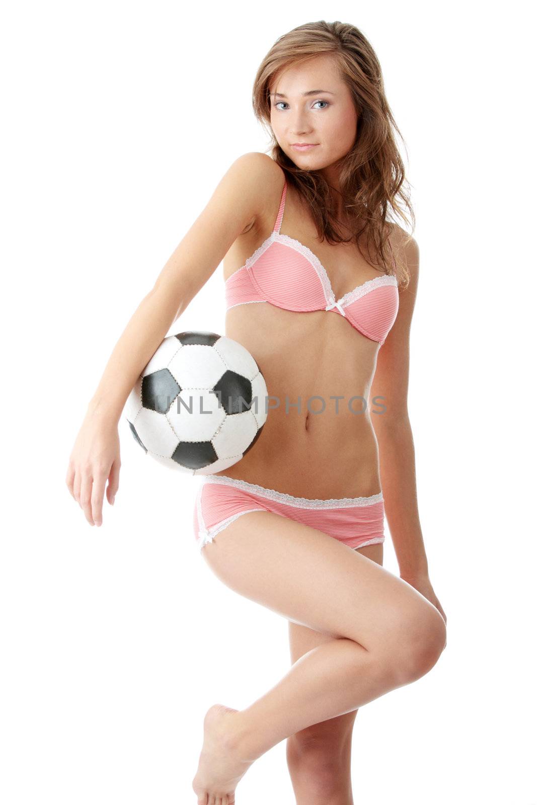 Fashion young woman with a football ball isolated over a white background