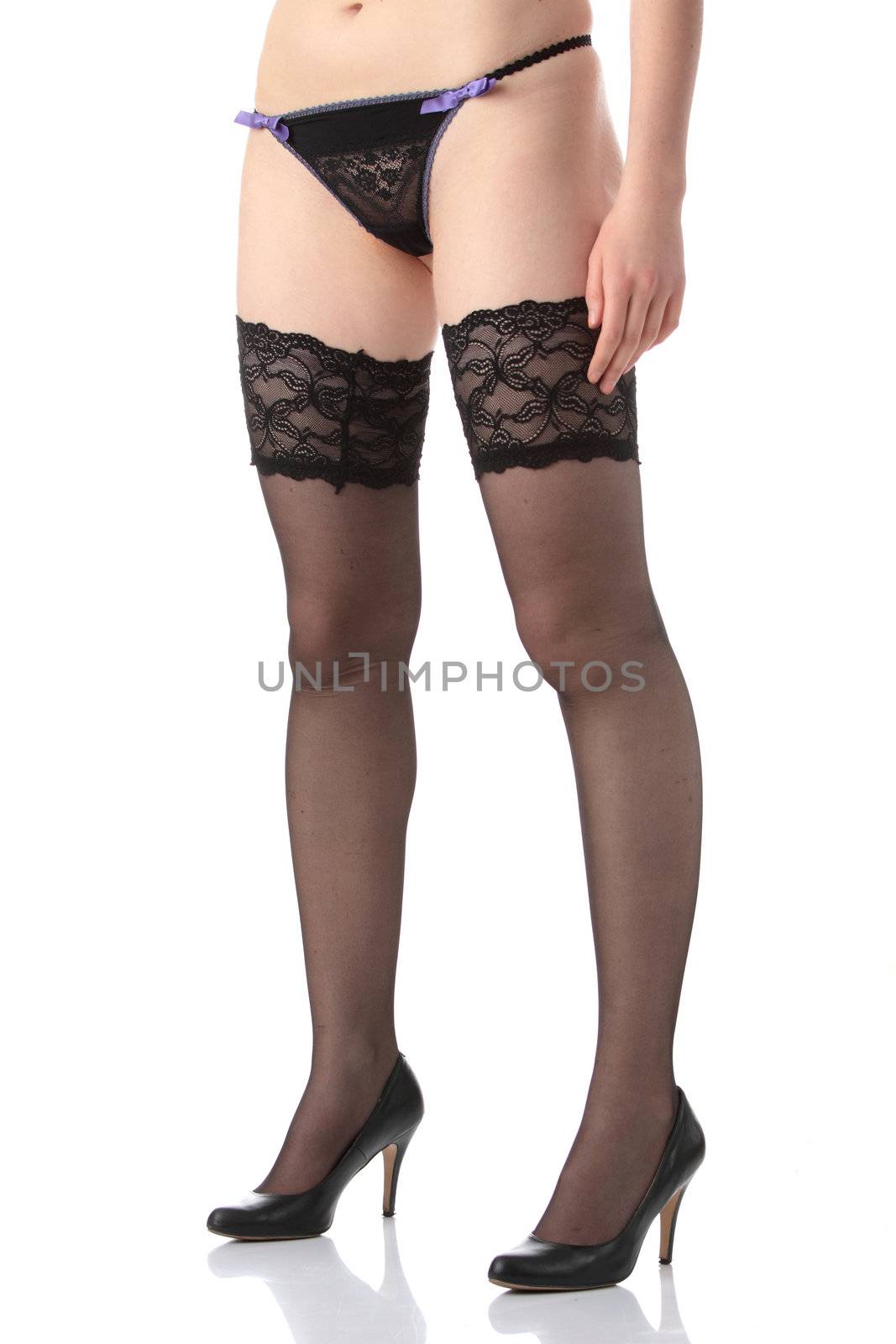 Sexy legs in stockings isolated on white background