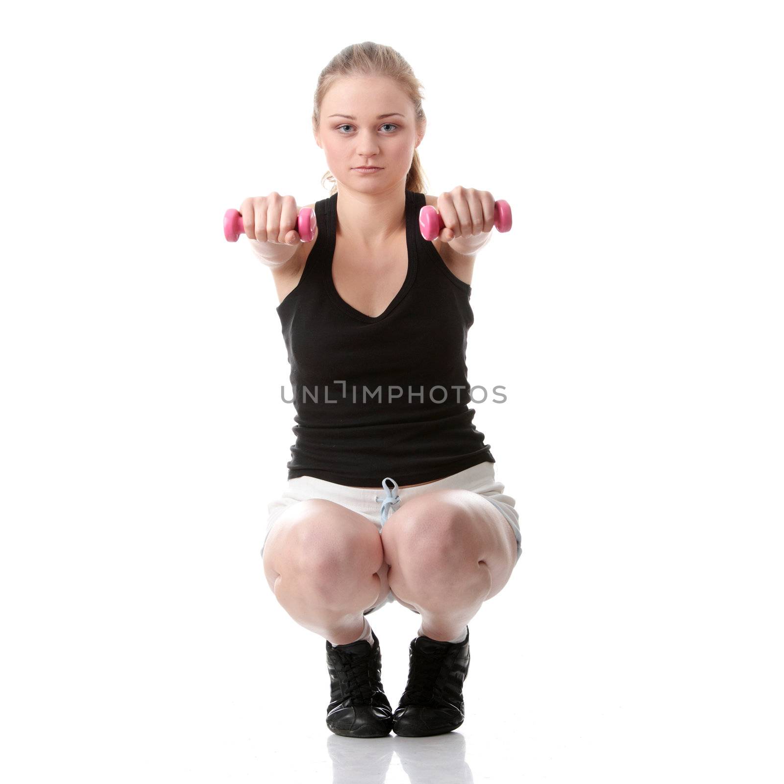 Beautiful young blonde exercising, isolated on white background