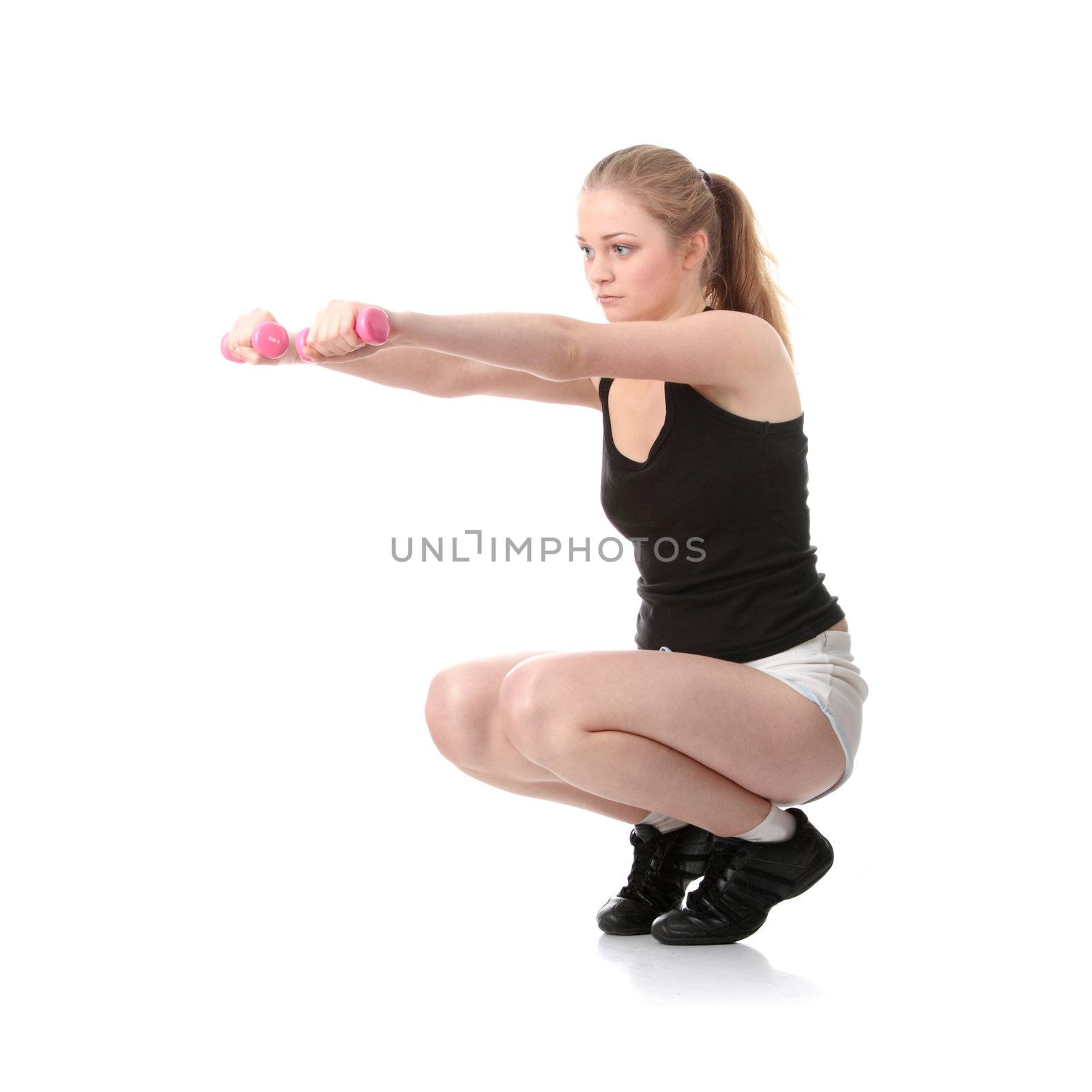 Young blond woman exercising by BDS