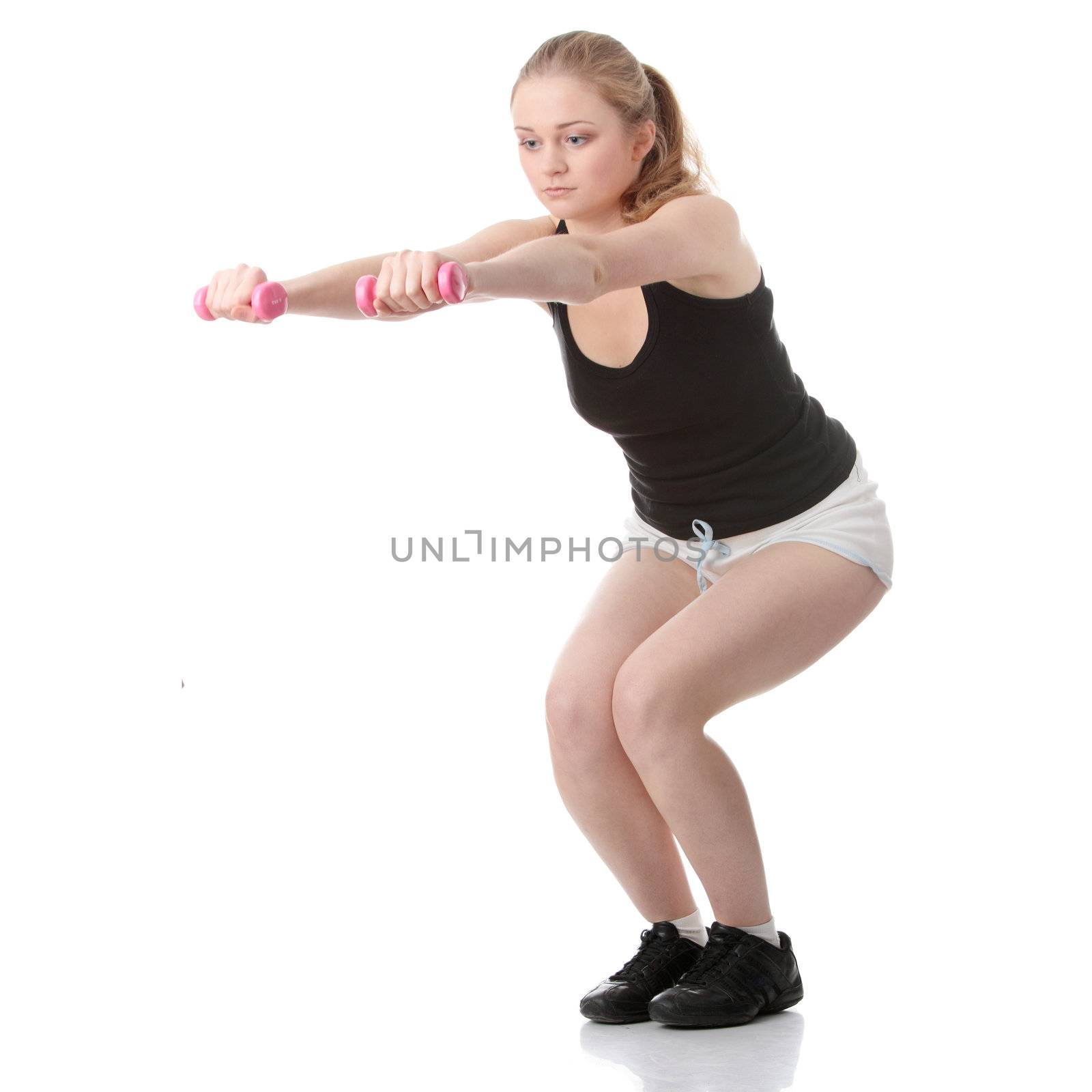 Beautiful young blonde exercising, isolated on white background