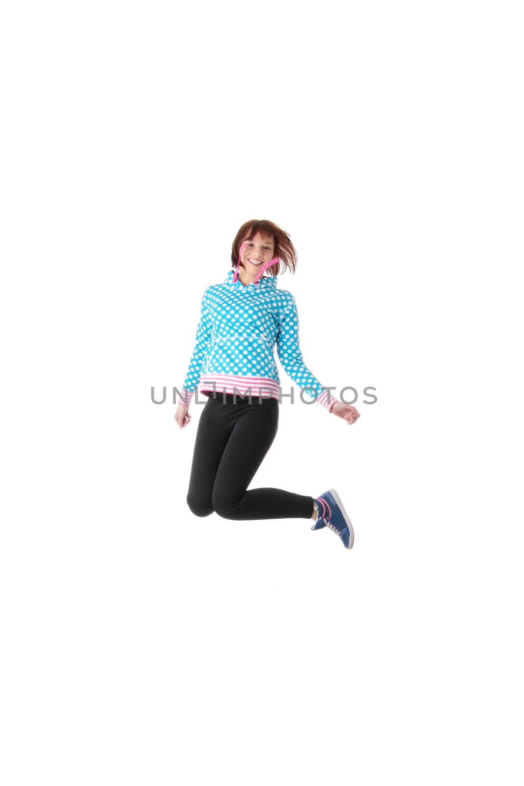 Young smiling teen girl jumping by BDS
