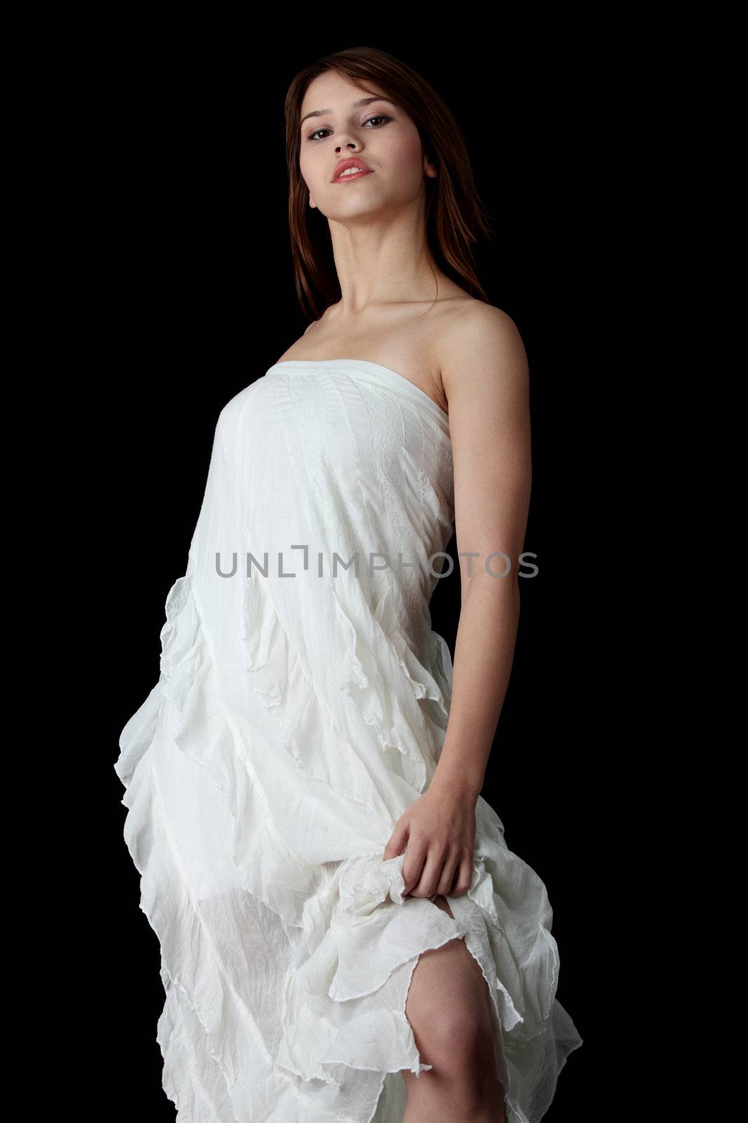 A young beautiful woman in white dress