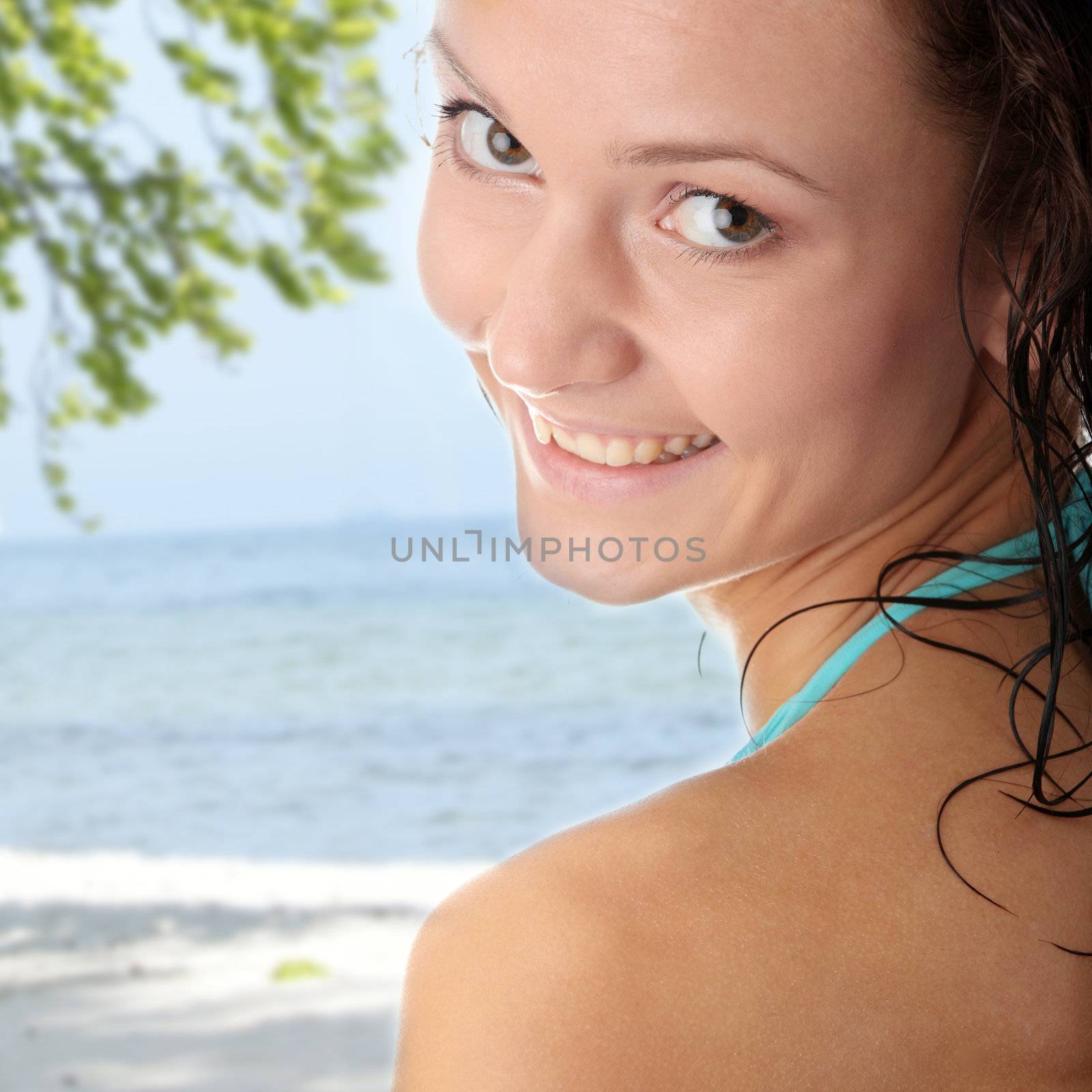 Young wet woman in blue bikini