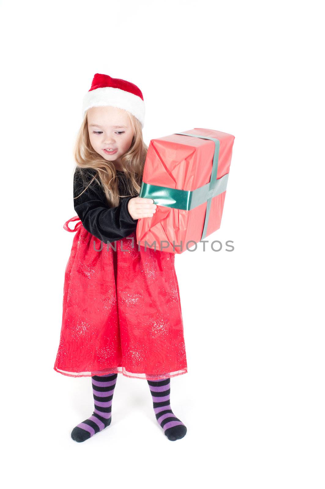 Beautiful baby girl dressed up for Christmas isolated in white