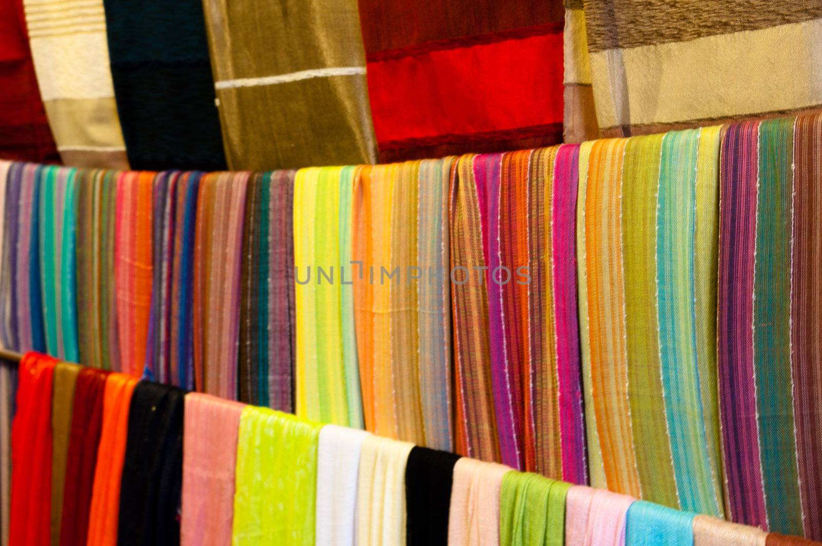Variety of colorful scarves soled in Medina in Marrakech, Morocco