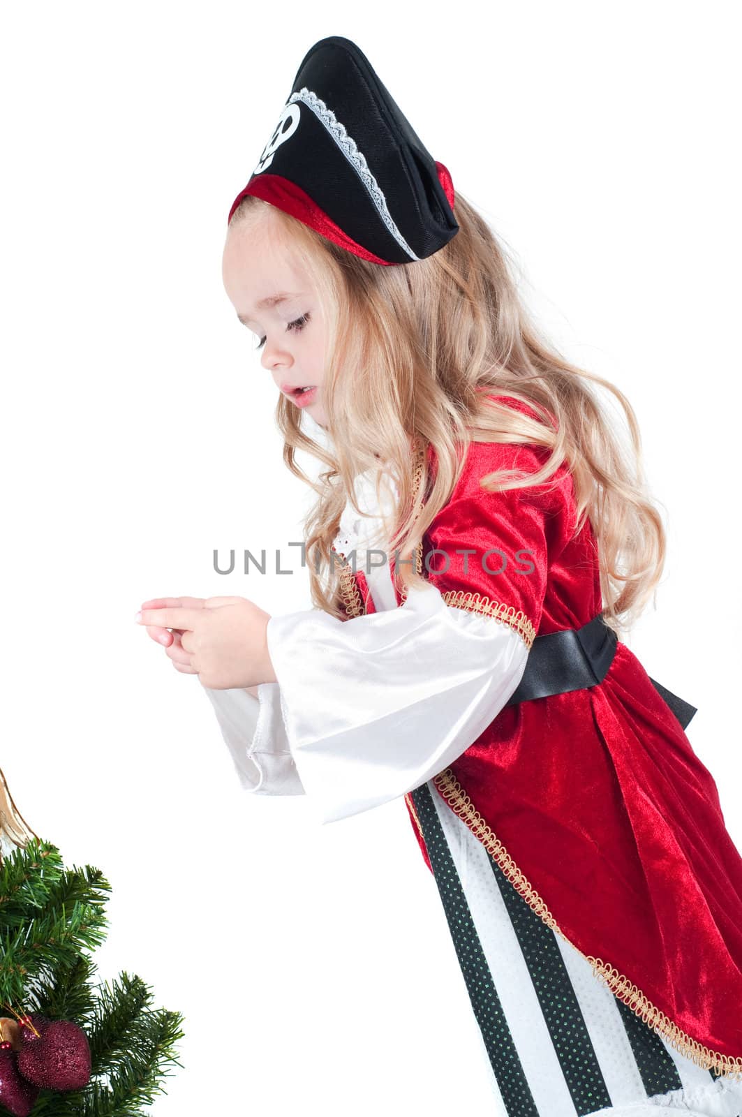 Beautiful baby girl dressed up for Christmas isolated in white