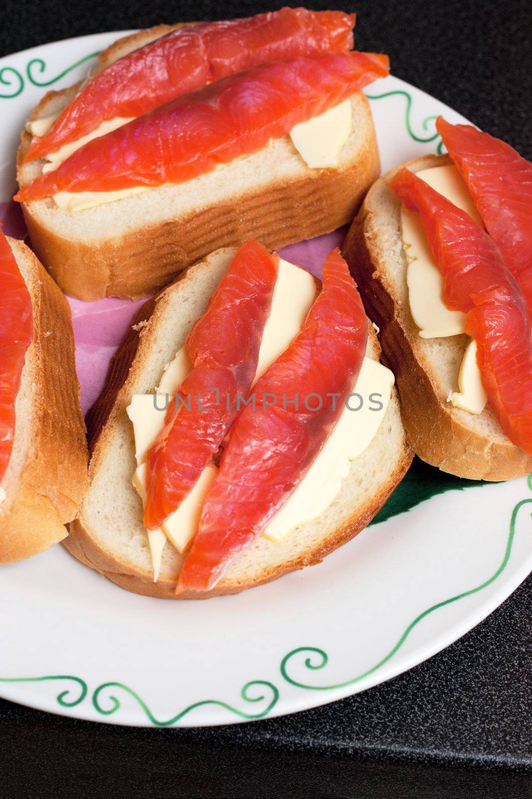 Fresh wild salmon fish fillet steaks on a bread and butter