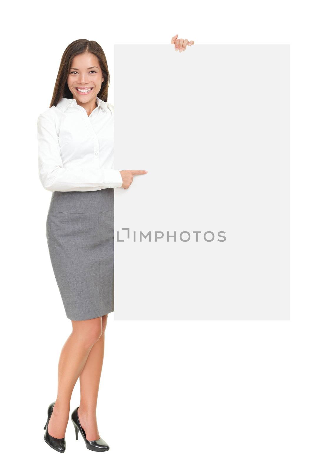 Businesswoman holding white blank empty billboard sign with copy space for text. Beautiful young mixed race Asian Caucasian woman isolated on white background in full length.