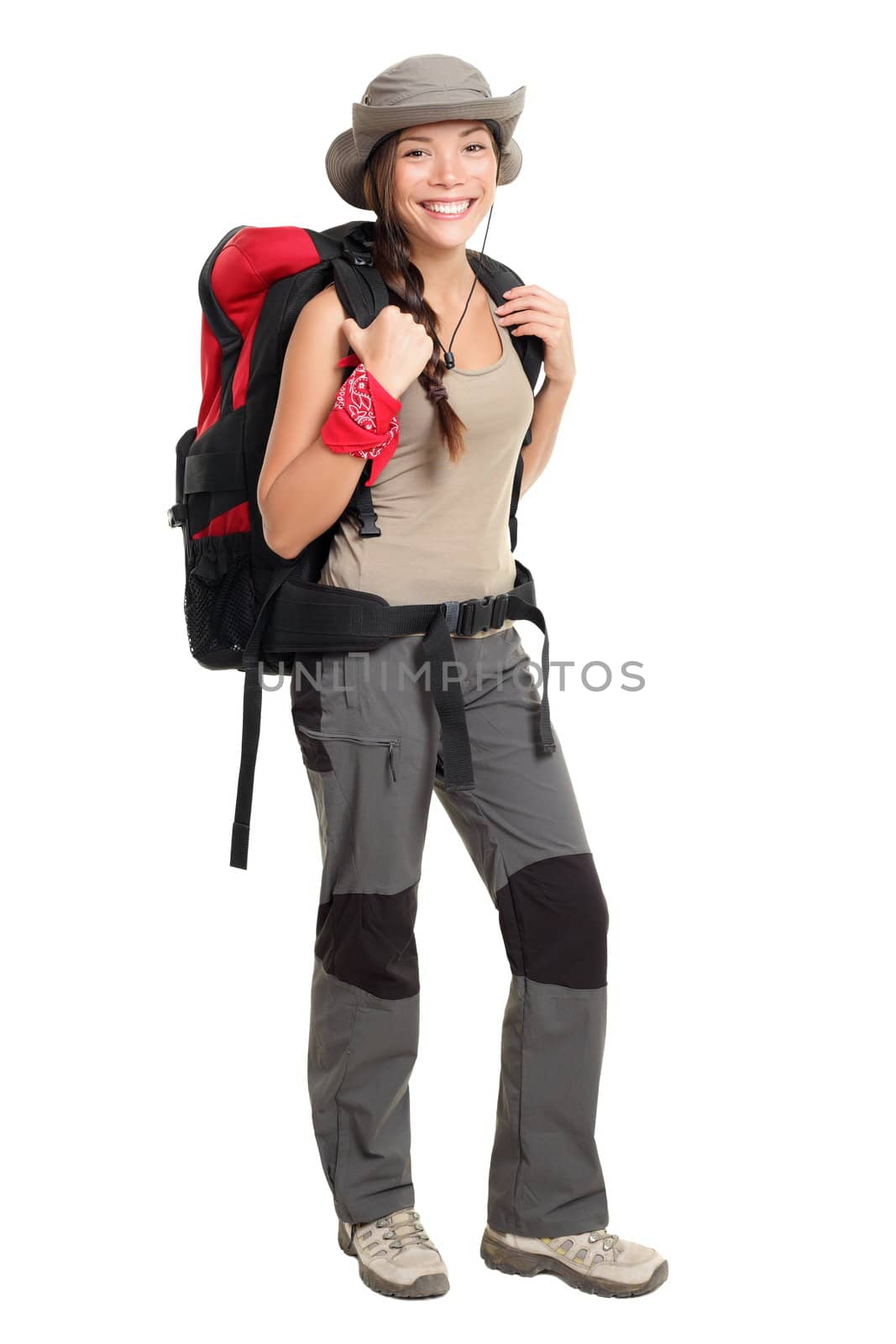 Hiker woman isolated on white background standing in full length. Beautiful Mixed race Asian / Caucasian female in outdoors hiking outfit.