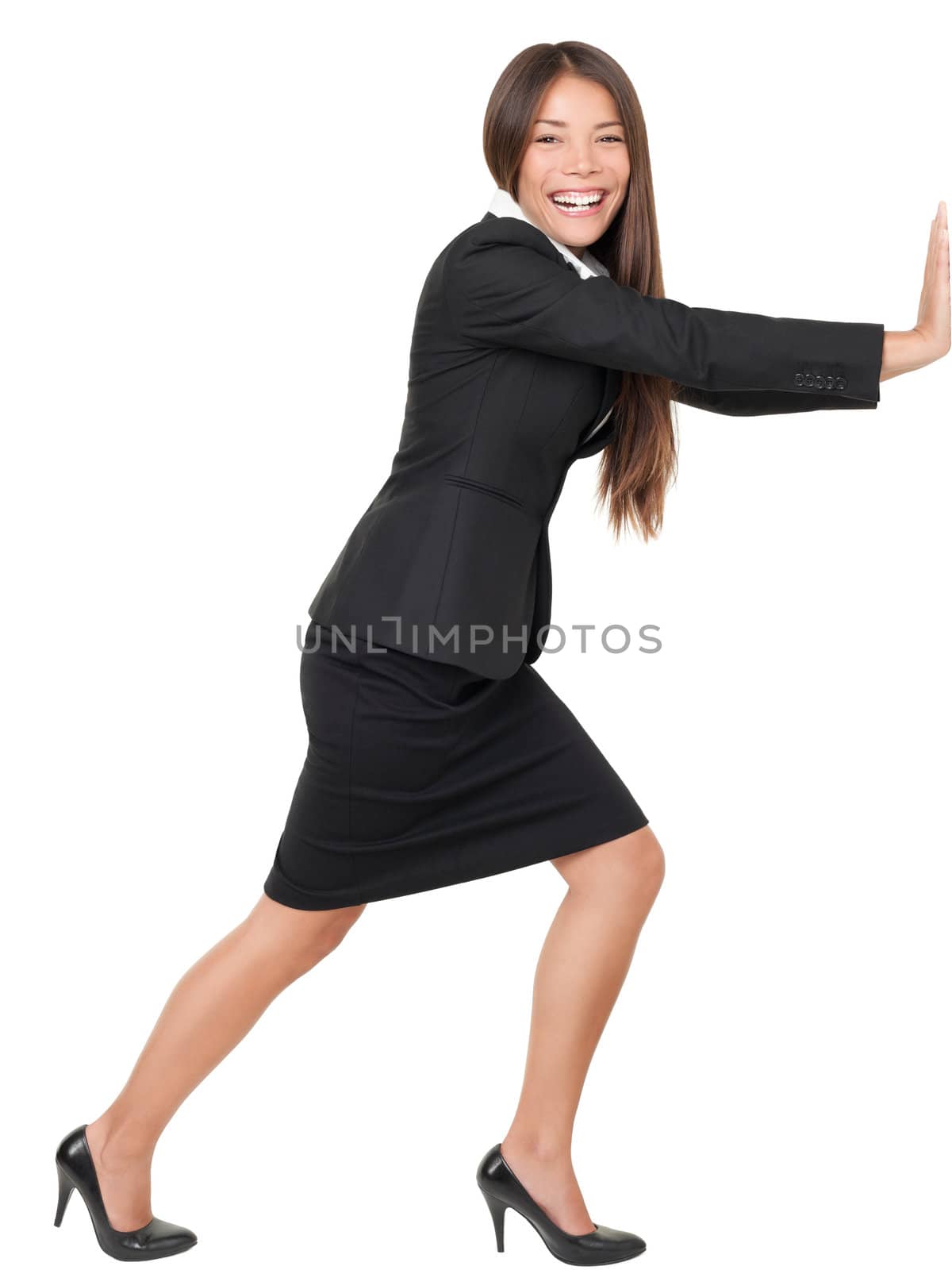 Woman pushing or leaning on wall. Beautiful asian woman smiling isolated on white background in full length.