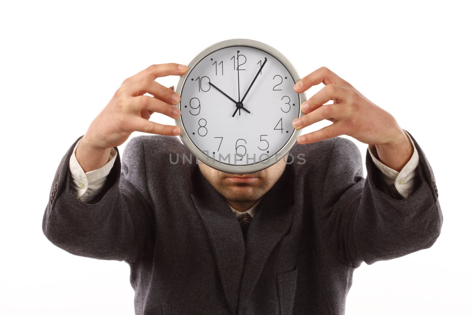 businessman holding the clock over white. Time for work concept 