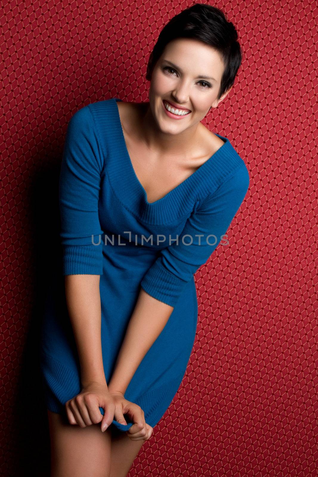 Smiling woman wearing blue dress