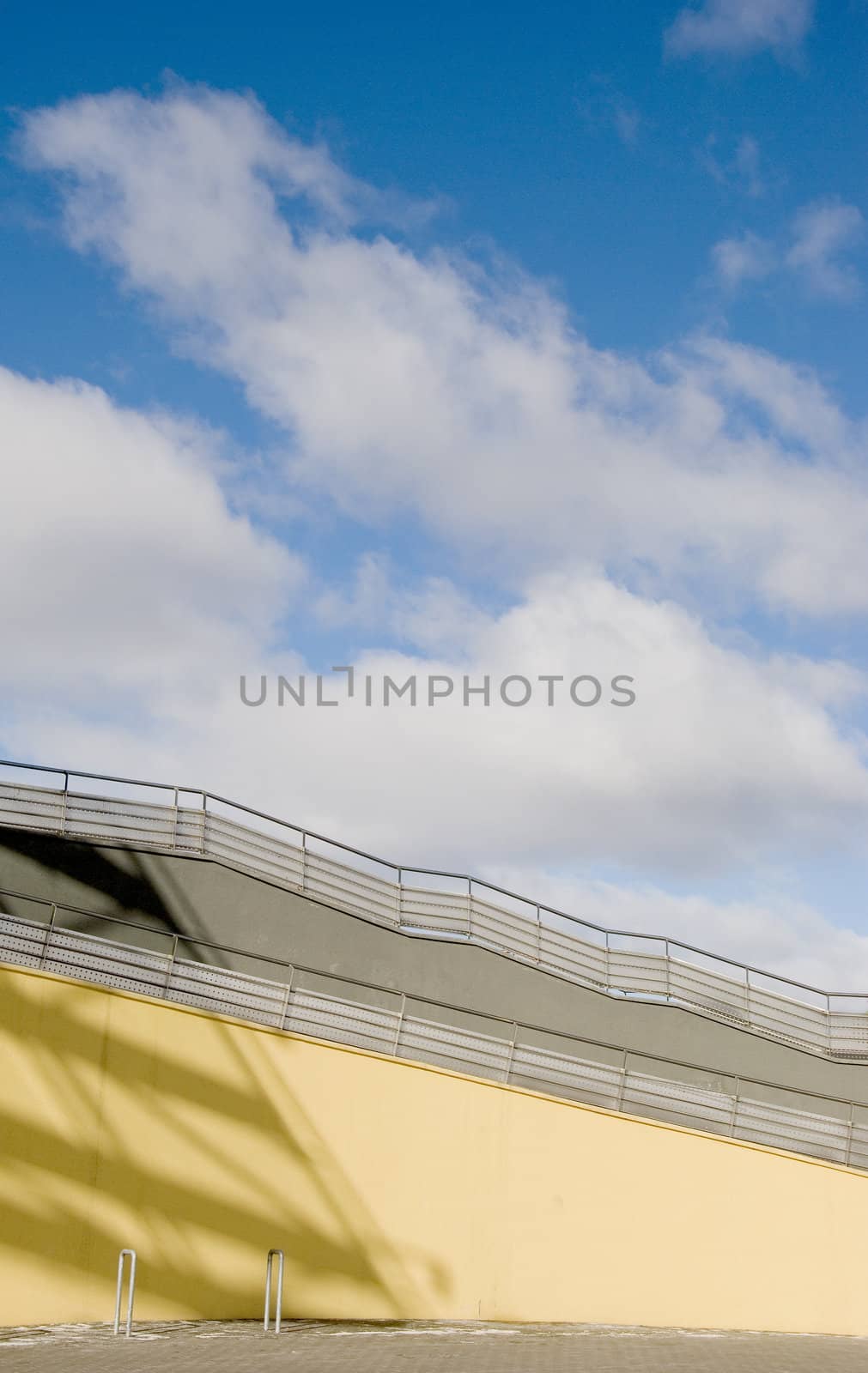 Staircase fragment on sky and clouds background