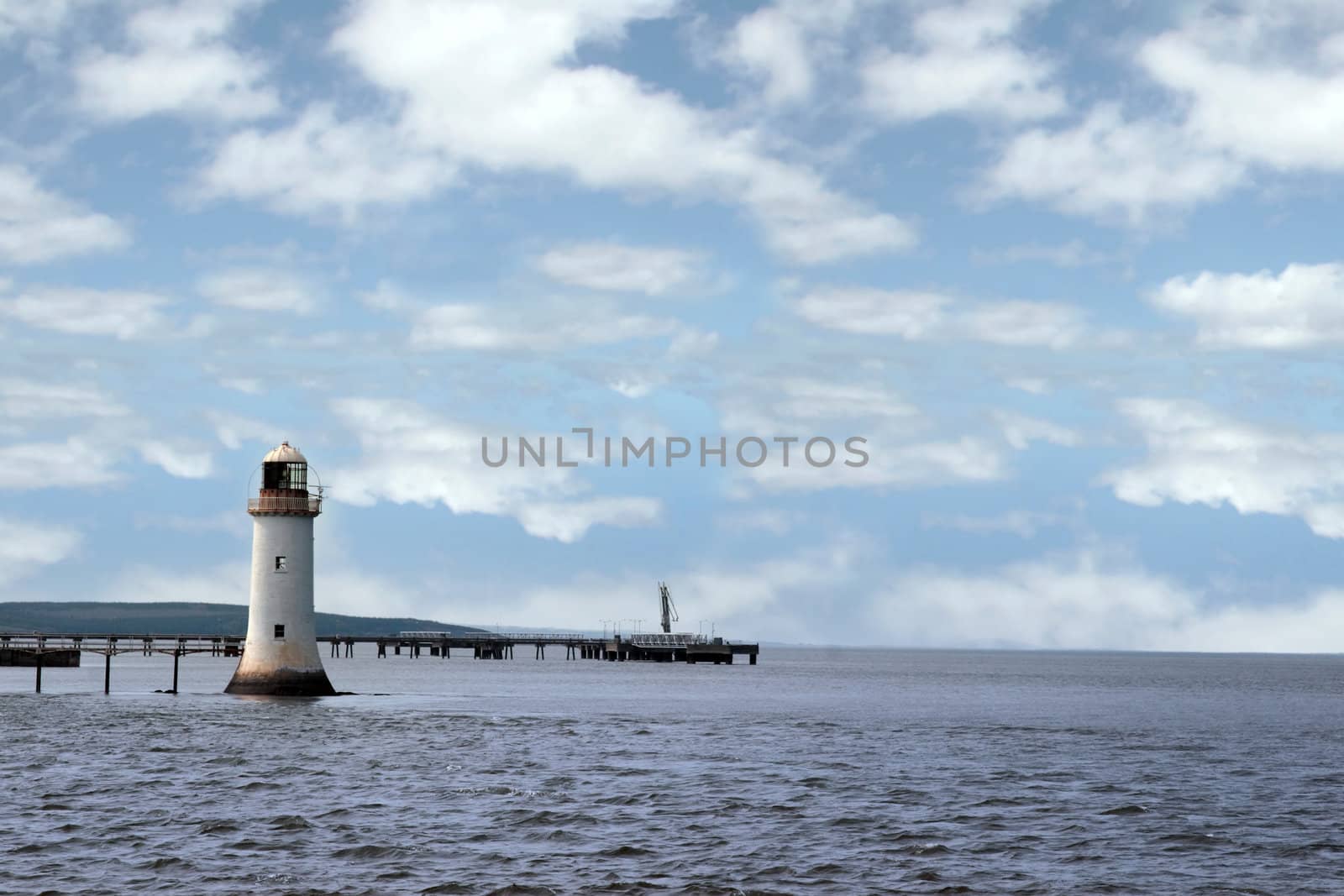 a lighthouse on the mouth of the river shannon