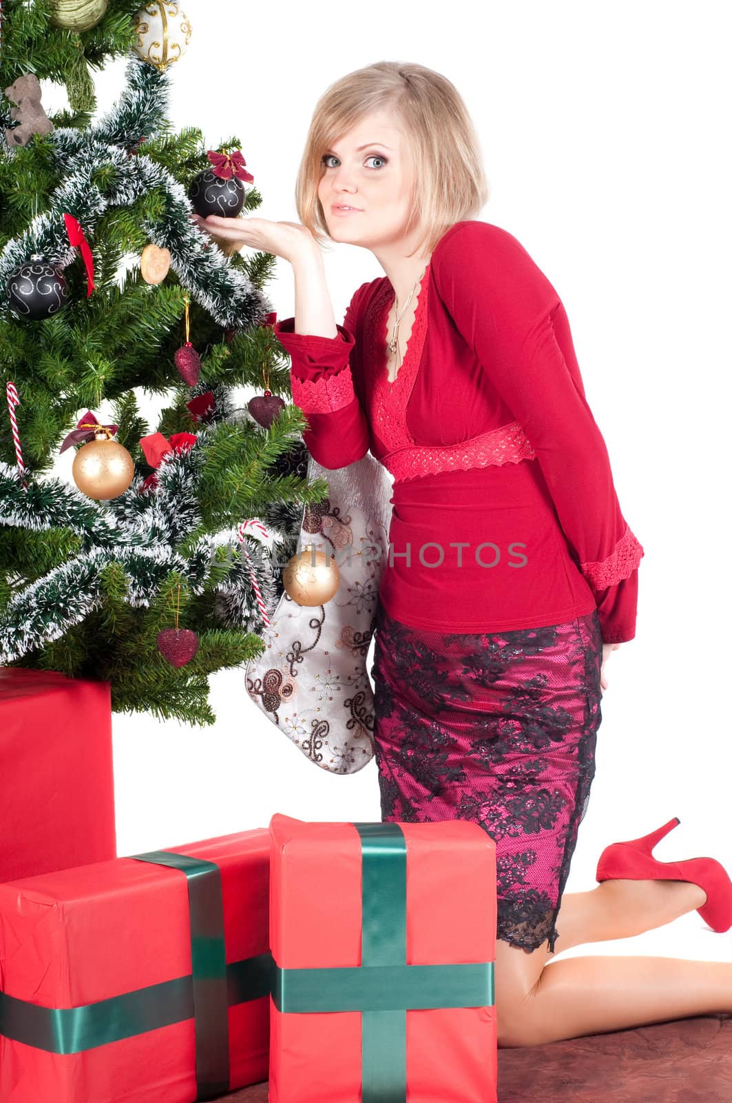 Happy woman with Christmas presents and tree isolated on white