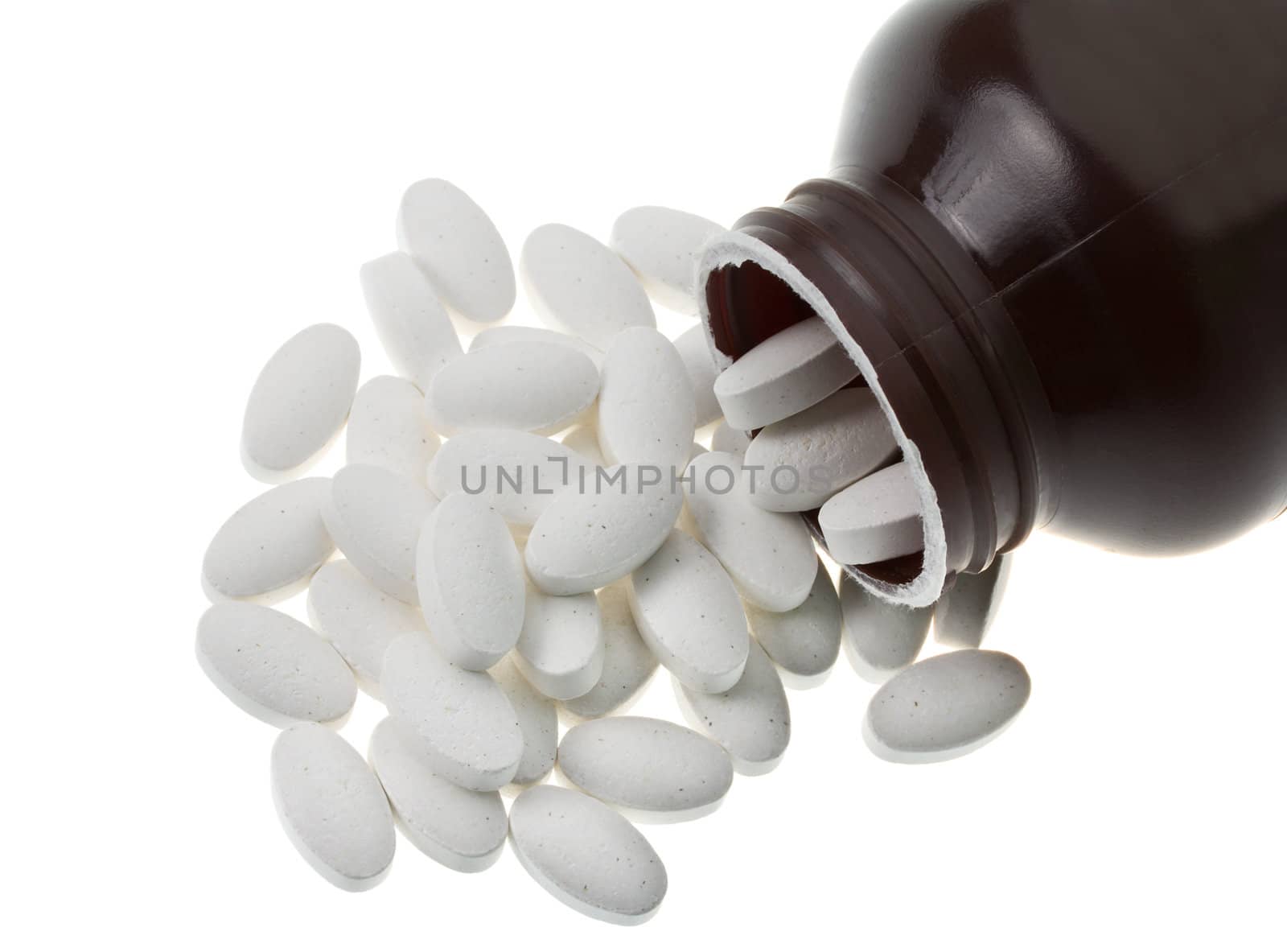 close-up white pills, isolated on white