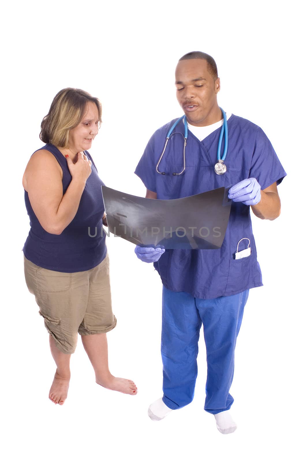 Doctor and patient discussing a x-ray, isolated over white